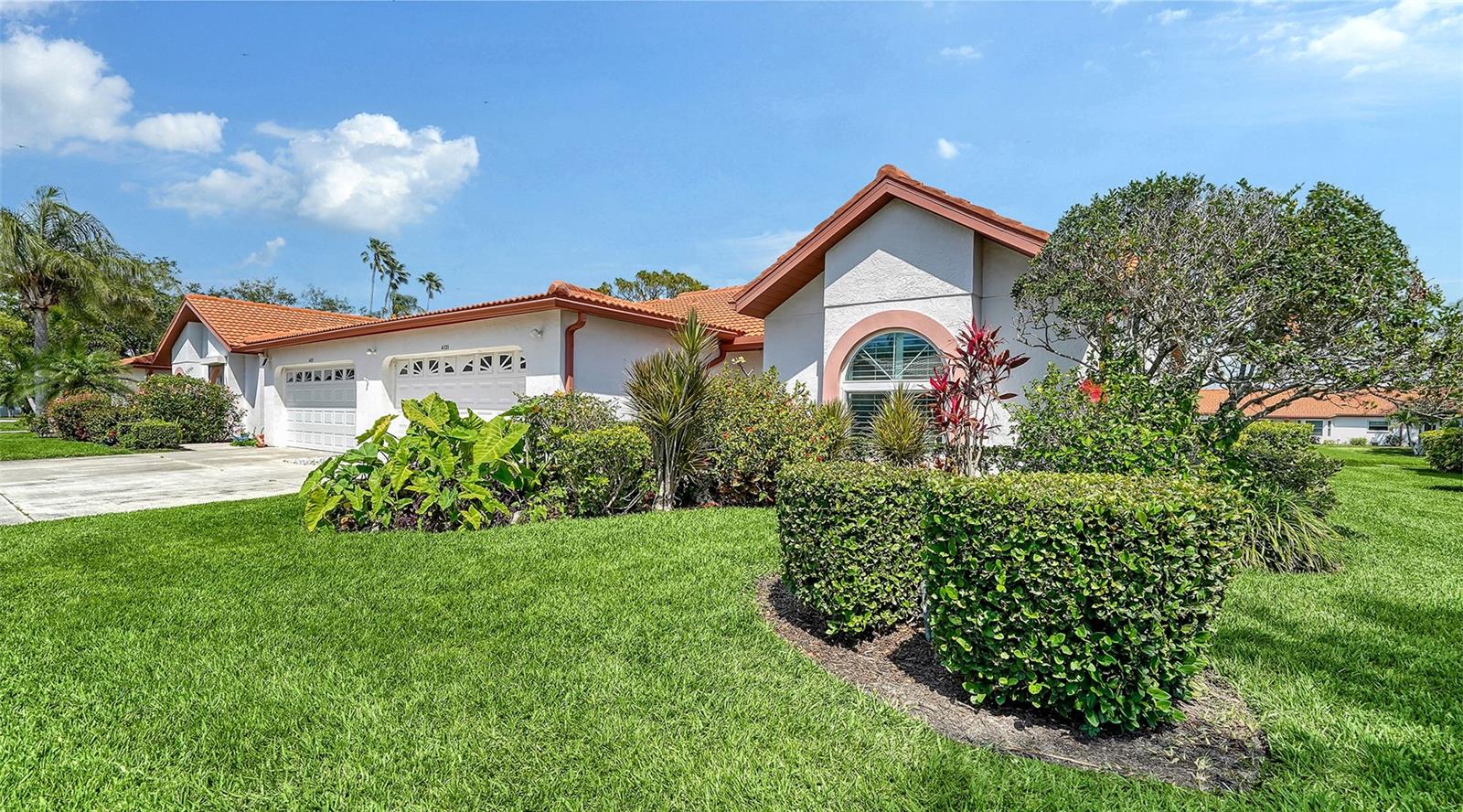 $10,000 price reduction! Lovely well maintained and updated home with lake views. Very open floor plan with cathedral ceilings. Hurricane windows throughout with the exception of the Florida Room. Newer appliances and plantation shutters on all windows. Primary bedroom is large and has a bay window that enhances the water views. Primary bedroom has his and hers closets and an ensuite bathroom. Kitchen and the 2 bathrooms have been recently renovated. Dining room area has a electric fireplace on the wall and a tube skylight. The lanai (Florida room) can be accessed from kitchen or living room. Lanai offers a comfortable area to enjoy the peaceful surrounding. As you walk out lanai door, there is open outdoor patio with seating and an area to BBQ. Community is not a 55 plus, it offers a large clubhouse with pool, fitness area, tennis court and a shuffleboard area. Community is very vibrate and has many engaging activities. Location is wonderful for restaurants and shopping. Also, a quick 15-minute drive to Siesta Key beaches and village. Furnishings are optional with the exception of the carousel table in the living room, the bowl on the table and the items in second bedroom closet.