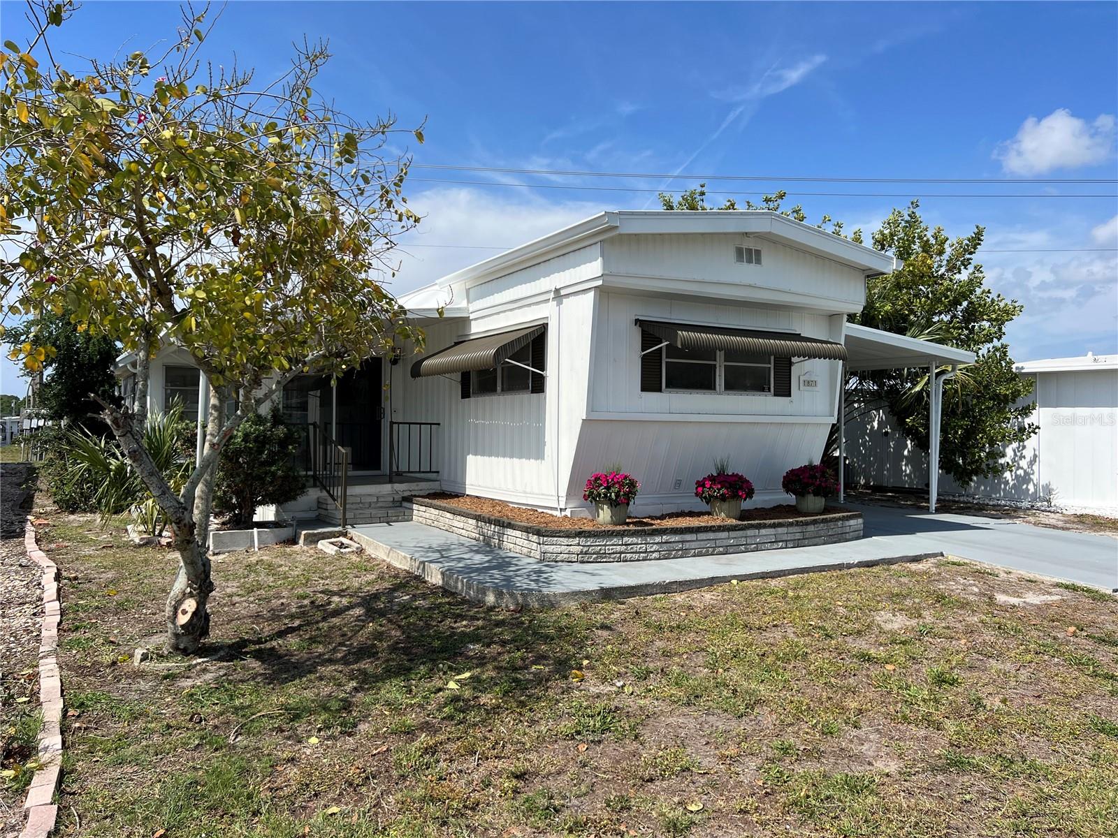 Beautifully renovated home. This 2 bedroom - 2 Bath home has a 20 X 12 screened lanai. Currently leased for $1500/mth! The home has new flooring, paint and fixtures throughout and all new appliances. Big ticket replacements include...electrical panel, hot water heater and TPO roof! Tri Par is a friendly 55+ park with lots of activity. Some activities include Thirsty Thursdays, large pool area with jacuzzi, pickleball, horseshoes, miniature golf, holiday dinners and dances, shuffleboard, and much more. It is located near the Downtown Arts District, marina, eateries, banking, hospital, shopping, airport, I-75, UTC Mall, Benderson Park and best of all the beautiful beaches always rated among the top beaches in the U.S. This park is land owned with no monthly fees, (Tri Par receives a special tax dispensation -the $1322 annual fee is paid from your property taxes each year). Make this your rental and enjoy the cash flow!