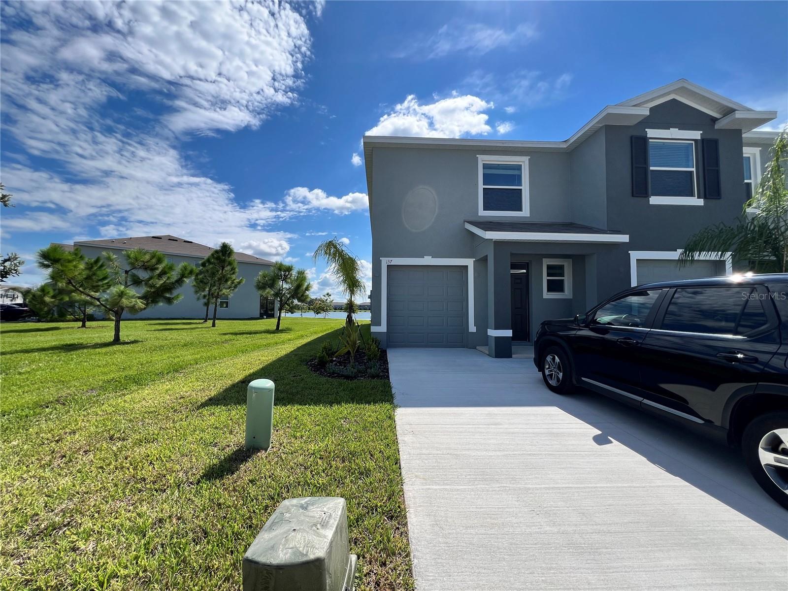 Brand new spacious END unit 3-bedroom, 2.5-bath townhome with a large green space and serene pond view in the Mangrove Point community at Apollo Beach, perfect for long-term tenants. This home offers one enclosed garage plus additional parking in front of the unit.
The first floor features a spacious living area and kitchen, while the second floor offers three bedrooms, two bathrooms, and laundry.
From your lanai, which faces the sunrise, enjoy the peaceful pond view to start your mornings. Or, head to the community pool for a refreshing swim! This home is located in the block right next to the pool.
Conveniently located near US-41. The home includes water and sewer, as well as a washer and dryer, with other utilities being the tenant's responsibility. Hurricane shutters included.