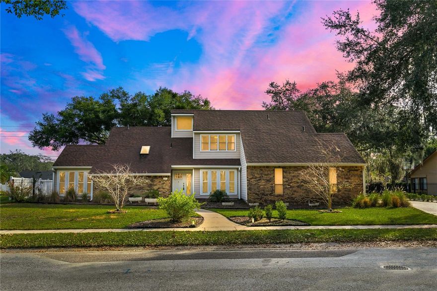 This beautifully updated home blends timeless character with modern comfort, offering an inviting layout designed for both everyday living and entertaining. The light-filled interior showcases a stunning, renovated kitchen with new quartz extended countertops, a butcher block island, recessed lighting, and a full suite of high-end appliances including a JennAir refrigerator, KitchenAid pull-out refrigerator and freezer with ice maker, double oven and stovetop, wine and beverage cooler, and dishwasher. Major system upgrades add peace of mind and efficiency, featuring a newer roof installed in 2021, a fully paid off 11.745 kW (DC) solar system paired with a Tesla Powerwall 2.1 (7 kW DC battery capacity), whole-home water filtration and softener, high-efficiency heat pump water heater, new double-paned windows, Nest thermostats for upstairs and downstairs climate control, upgraded outlets with USB and modern switches, and new blinds throughout. The spacious primary bathroom has been fully remodeled with glass shower doors, new quartz countertops, and a farmhouse sink. Outside, enjoy exceptional curb appeal and a private backyard retreat with a screened-in pool, expansive paver patio, new extended paver walkway wrapping around the backyard, upgraded irrigation and sprinkler system, new gutters, and recently serviced chimney. The property is framed by mature, recently trimmed water and live oaks, enhancing both beauty and shade, while added features such as a new front door with wide extended entry, exterior Ring cameras and floodlights complete this truly move-in-ready home designed for a seamless indoor-outdoor Florida lifestyle.