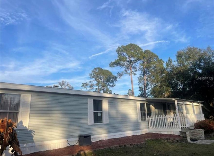 FIVE ACRES  *  NO HOA  *  4 BEDROOMS   *  2 BATHS   *  2,079 SQ FT HOME  *  NEW drain field Feb 2025  *  NEW well pump Feb 2025  * NEW water heater Sept 2024  *  Septic pumped Nov 2024 * 


Rare Country Living Opportunity Just Minutes from Town. 

Welcome to your private 5-ACRE RETREAT just 5 minutes from shopping and dining in Leesburg — and only about 20 minutes from the charm of Mount Dora, Eustis, and Tavares — three of Central Florida’s most walkable, eclectic lakefront towns filled with coffee shops, local boutiques, and one-of-a-kind restaurants.

Here, you truly enjoy the best of both worlds, 5 ACRES of peaceful country living with everyday conveniences close by.  

Move-In Ready with Major Upgrades Completed, the hard work has already been done for you. 

This spacious 2,079 sq ft one-story home offers a smart, no-wasted-space floor plan, designed for comfort & function. 4 generously sized bedrooms. 2 bathrooms. Walk-in closets. Large living room. Separate family room.  Dedicated dining room. Kitchen with breakfast nook.  Laundry room.   The primary suite features Double vanity, Walk-in shower, Separate soaking tub and a Walk-in closet. 

This amazing property is ready for Animals, Homesteading & Outdoor Living. 

One full acre is already fully fenced and thoughtfully set up, infrastructure is in place for country living with Chicken coops, Animal pens and runs, Shed, and Built-in water lines for cows, goats, pigs, chickens, and more. 

Enjoy evenings on the covered front porch, weekends on the backyard deck, fires under the stars at your fire pit, fresh fruit from your trees, and wide-open sunset views that never get old.

FIVE Acres of Possibility, Freedom and Flexibility. 

Plant a garden. Build a pool. Work from home. Create a multi-generational retreat.  Start your homestead. Or simply enjoy the peace and privacy.

No HOA. Just space and opportunity.