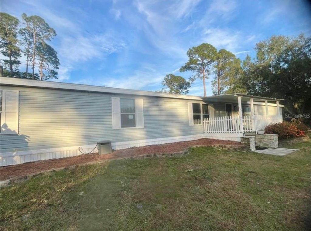 Photo of 8809 Treasure Island Road, Leesburg, FL 34788 (MLS # O6383720)