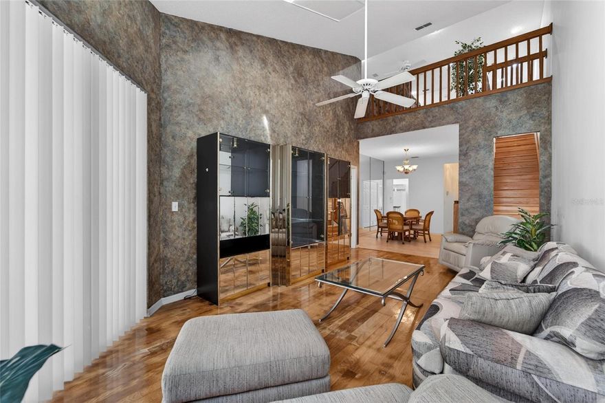 Location, Location, Location! Experience easy, low-maintenance living in this 3-bedroom, 2.5-bath townhome with a 2-car garage in sought-after Willow Greens. Located in a non-flood zone in a quiet neighborhood, this home features a first-floor primary suite with high ceilings, a large walk-in closet, a walk-in shower in the primary bathroom, and sliding glass doors to the lanai, a convenient downstairs half bath, and high ceilings throughout most of the home. Enjoy abundant natural light, two skylights in the living room, ceiling fans throughout, beautiful wood flooring in the main areas and on the stairs and sliding glass doors from the living room to the large covered and screened lanai. The kitchen offers an eating nook, perfect for casual dining. Relax on the covered and screened front porch or entertain on the spacious covered and screened lanai. Upstairs offers two additional bedrooms, a full bath, and a spacious loft with private balcony. The loft view overlooking the first floor from the upstairs den area provides an open and spacious feeling. Additional features include a, water filtration system, water softener, and reverse osmosis system. HOA covers water, sewer, trash, cable, landscaping, exterior maintenance, roof, and exterior insurance. Community amenities include a pool, spa, clubhouse, and scenic lake views, all just a short walk away. Conveniently located near beaches, shopping, golf courses, parks, churches, schools, restaurants, banking, hospitals, doctors, Clearwater, St. Petersburg, Tampa International Airport, and St. Pete-Clearwater Airport.