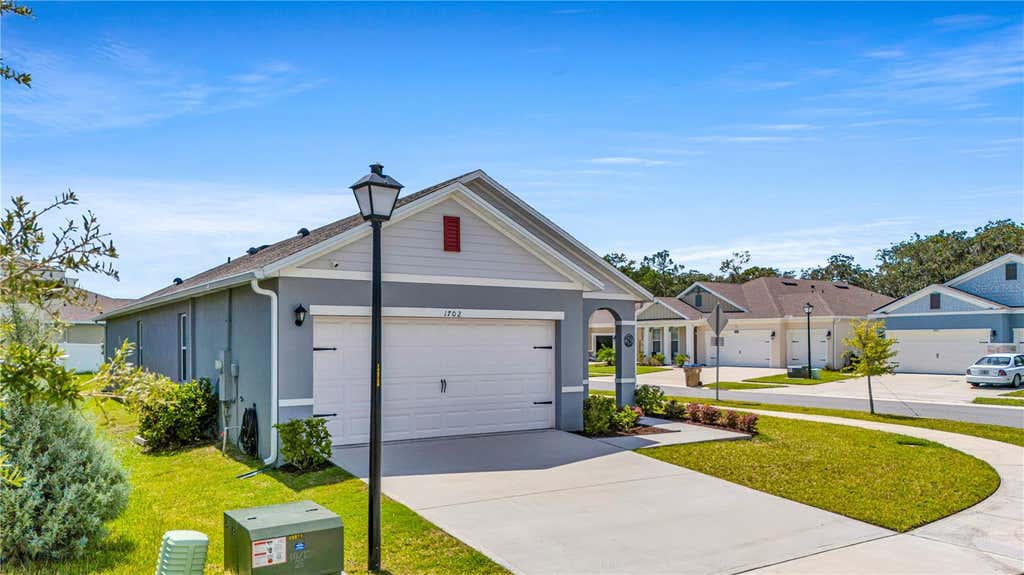 Photo of 1702 Walnut Creek Drive, Kissimmee, FL 34744 (MLS # O6432588)