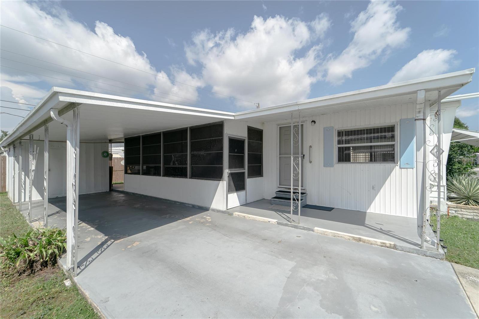 Affordable Florida Living—And You Own the Land! Welcome to the quiet and welcoming 55+ community of Fair Lane Acres! This clean, freshly painted 1-bedroom, 1-bath home may be compact inside, but it lives larger thanks to the spacious screened-in Florida Room—perfect for relaxing, entertaining, or even hosting overnight guests during the cooler months. This easy-to-maintain property includes covered carport parking, washer/dryer hookups, and a handy outdoor storage shed for your beach gear, tools, or holiday decorations. Fair Lane Acres is a pet-friendly community offering a pool, shuffleboard, and regular activities for residents to enjoy. The low monthly HOA fee of just $131 includes water and sewer, making this an incredibly budget-friendly option for snowbirds or anyone looking to downsize and simplify. And don’t forget—you’re just minutes from world-class beaches, great dining, shopping, and everything the beautiful Gulf Coast has to offer. This could be your perfect winter getaway or cozy year-round home base in sunny Florida. Come take a look!