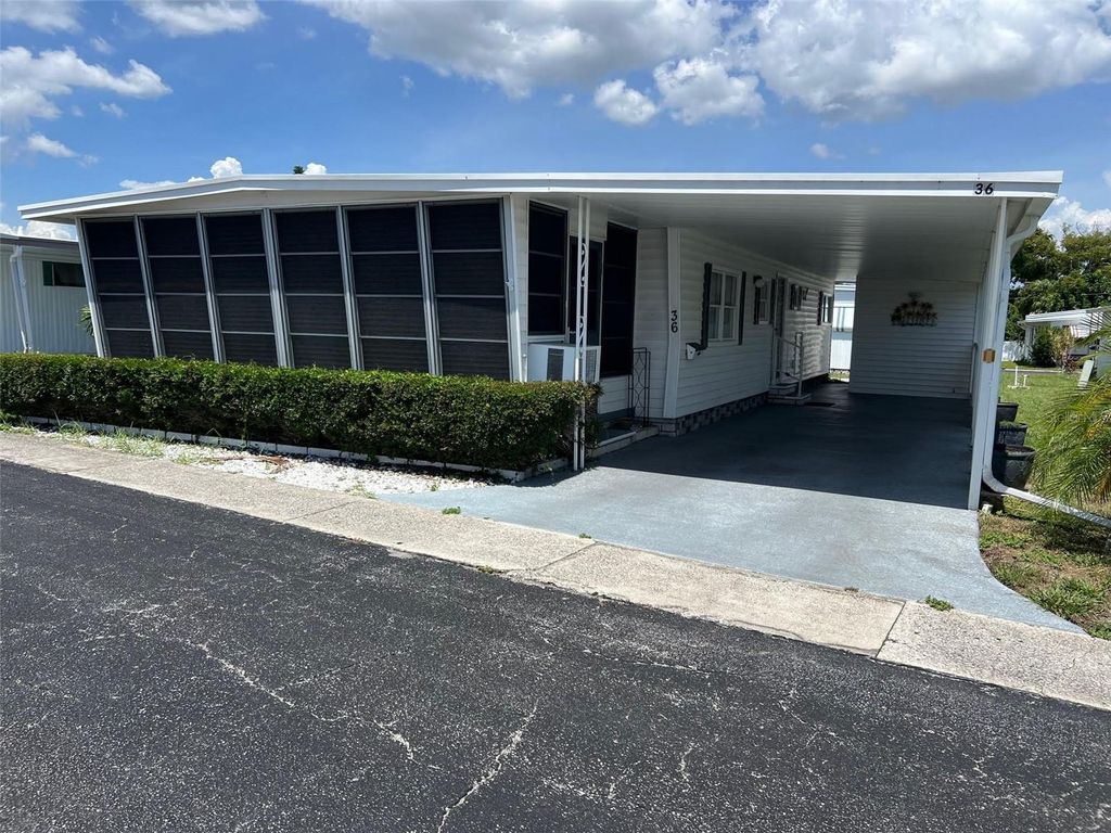 Photo of 36 Thatch Palm Street E, Largo, FL 33770 (MLS # TB8396188)