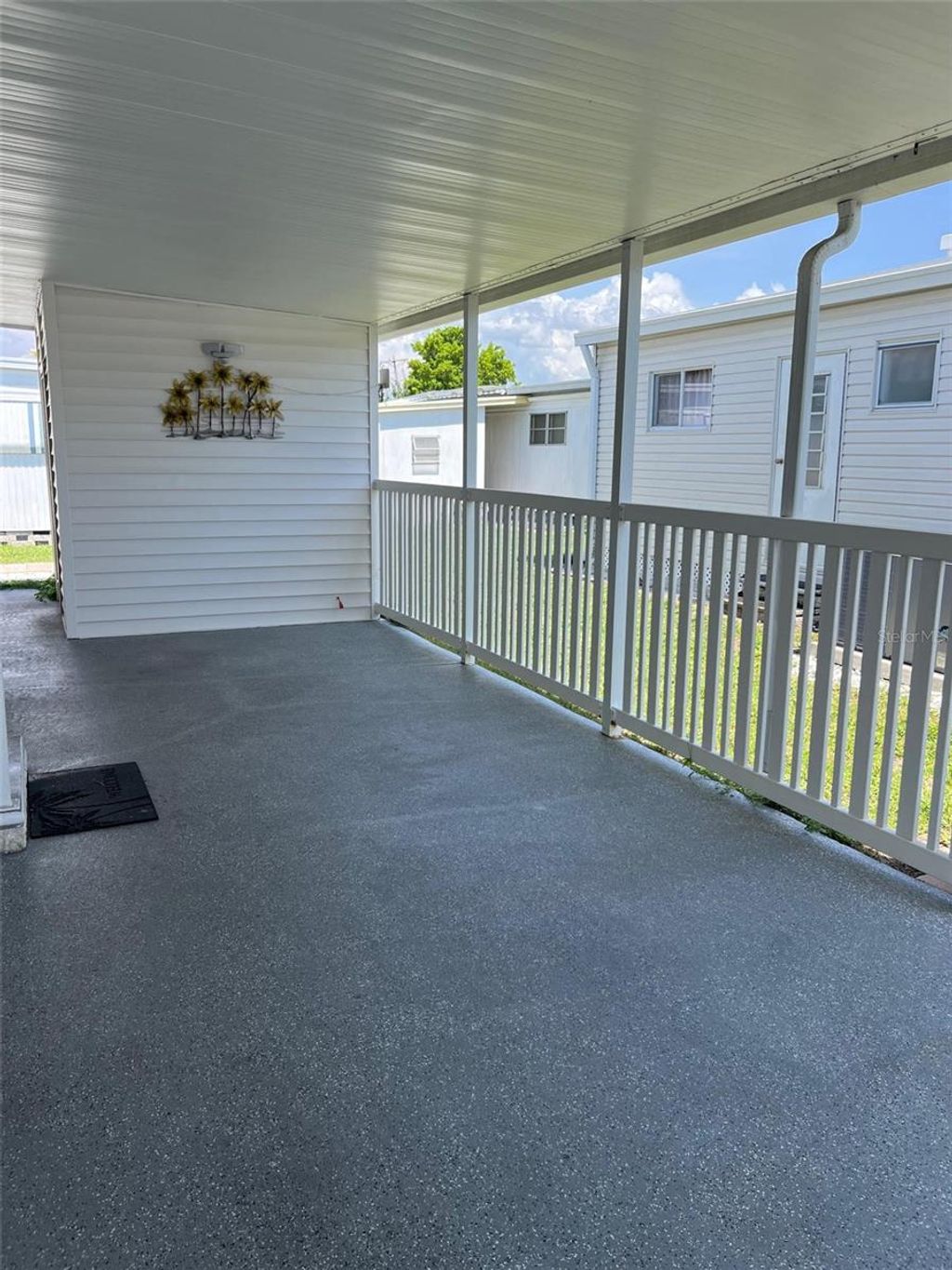 Photo of 36 Thatch Palm Street E, Largo, FL 33770 (MLS # TB8396188)