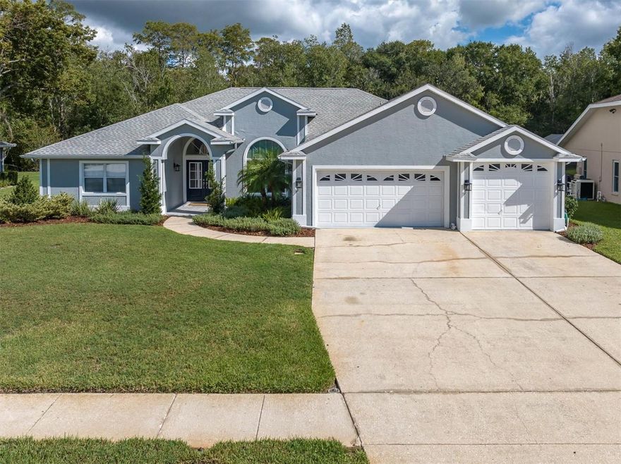 Welcome Home! This meticulously maintained pool home offers stunning conservation views! Located in the highly sought-after community of Trinity Oaks, it is a must see! This home offers 4 bedrooms, 3 baths, and an oversized 3 car garage. It boasts over 2600 square feet of exquisite open concept living and is situated on .26 acres. As you enter the double glass front doors you are immediately taken back by the views of the conservation and newly remolded pool, that are seen through the large pocketed sliders.  The enormous formal living room and dining room are also located here and allow for amazing views and ample entertaining space. The kitchen offers new appliances and a spacious eat in dining area.  The family room is located right off the kitchen and offers stunning views of the pool and conservation area. The split plan home offers plenty of privacy with the Master retreat secluded on one side of the home. The Master bedroom offers sliders with direct access to the pool area, large walk-in closets, and an oversized shower and garden tub with Quartz countertops. The other 3 large bedrooms are located on the other side of the home and offer ample closet space. These bedrooms easily hold queen sized beds and dressers while still leaving plenty of open space. The guest bathrooms have Quartz countertops. One of these bathrooms has direct access to the pool and has a new vanity. The backyard area is an entertainer's dream. Large covered areas with ceiling fans are perfect for backyard gatherings year round.  The saltwater pool, hot tub, and pavers were remodeled in 2022. This home offers an oversized laundry room with sink cabinets and additional home office space. The exterior of the home was painted in 2019 and the interior of the home was just painted this week. The exterior garage door and front doors were both replaced in 2019. Washer and Dryer are less than 1 year old. Low HOA, No CDD fees, No Flood Insurance, Community Playground, and Top-Rated Schools, this home has it all. It is also located near golf courses, shopping, parks, and an easy drive to the beaches or to Tampa. Schedule a showing today and don't miss the opportunity to call this place HOME.