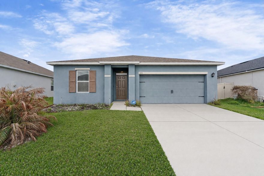 One or more photo(s) has been virtually staged. Welcome to 265 Meadowbrook Blvd, Winter Haven, FL 33881—this well-maintained 3-bedroom, 2-bathroom residence features a comfortable and functional layout designed for everyday living and entertaining. The home features an open-concept floor plan with generous living and dining areas filled with natural light, creating an inviting atmosphere throughout. The kitchen provides ample cabinetry and counter space, along with modern appliances, making it both practical and efficient. The primary bedroom includes a private en-suite bathroom and a walk-in closet, while the additional bedrooms provide versatility for guests, a home office, or other needs. Step outside to a spacious backyard with plenty of room for outdoor activities, gardening, or relaxation. Conveniently located with easy access to major roadways, this property is just minutes from shopping and dining options at Posner Park and Eagle Ridge Mall, as well as outdoor recreation at Lake Shipp Park. Enjoy proximity to popular attractions like LEGOLAND Florida Resort and convenient travel via Orlando International Airport. This property presents a great opportunity to own a move-in ready home in a centrally located area close to everyday conveniences, entertainment, and recreation.