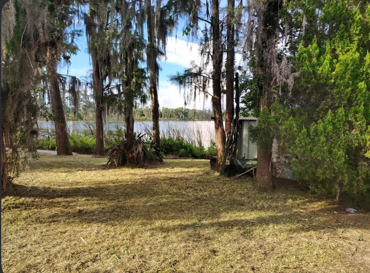 Lakefront Living Near Disney!
Don’t miss this rare opportunity to own a lakefront lot on beautiful Lake Reddick. This property is being sold for the land value only—offering a blank canvas to create your dream homesite. The existing mobile home is in need of removal, allowing you to start fresh.
Orange County has advised this property has 2 designations, A2 (Agriculture) and Future Land Use Low Density Residential. A mobile is not permitted to take the place of existing mobile home. Minimum Requirements for a mobile home is now 2 acres. Will need verification from Zoning for a single family. Currently waiting on Zoning to advise more details.
Located just 20 minutes from Walt Disney World and close to shopping, dining, and popular attractions, this peaceful lakefront setting combines convenience with serenity.
With a little vision and TLC, this could be your ideal weekend escape, seasonal retreat, or full-time residence on the water!