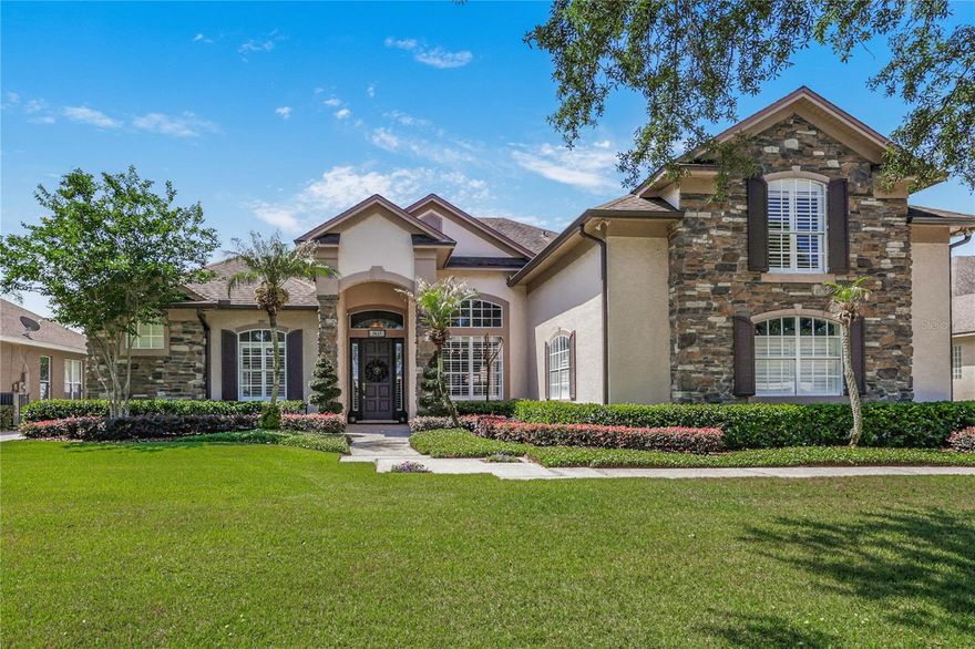 Discover this stunning 5-bedroom, 4-bath custom Brierhill home that delivers the space, quality, and location in the coveted Estates of Cypress Landing. Your family will enjoy a short five-minute walk to the top-rated Windy Ridge K-8 School and convenience to all that the Dr. Phillips community has to offer. The home is thoughtfully designed for large and multigenerational families with a split floorplan offering 4 bedrooms and 3 baths on the main floor, plus an ensuite bedroom above the side entry 3-car garage. Step inside to find 14-foot ceilings, hickory hardwood floors, custom interior shutters, abundant natural light, and serene pool and lanai views from the formal living and dining rooms. The primary suite features a large bedroom providing a peaceful retreat with pool access as well as a luxurious bathroom featuring split vanities, soaking tub, separate shower, linen closet, walk-in closet, linen closet, and private toilet room. An adjacent study/nursery completes this spacious suite, which is privately situated on one side of the home. The open-concept kitchen offers custom cabinetry, granite countertops, stainless KitchenAid appliances, and a breakfast nook overlooking the pool. The adjoining family room features a stone-wrapped gas fireplace, 85" television, custom built-ins, motorized shades, and a Denon surround sound system. Additional main-level spaces include two bedrooms with a Jack-and-Jill bath as well as a third bedroom, pool bath, and a handy hallway desk nook. Upstairs you will find a private ensuite bedroom, a separate storage closet, and an easily-accessible mechanical room. The outdoor living area—perfect for relaxing or entertaining—includes an oversized lanai, bar area, and a resurfaced pebble-finish pool with glass tile accents. A fenced yard and open green space provide added privacy. Custom upgrades include: Hardwired 12,000-watt generator with automatic transfer * Whole-house water filtration and dual hybrid 50-gallon water heaters * 120-gallon subterranean propane tank * Perimeter high-resolution cameras, monitored fire and security system * Automated irrigation * Premium light fixtures and ceiling fans **All mounted TVs and large appliances convey. Wall-niche mosaics do not convey. Cypress Landing amenities include a playground, two tennis/pickleball courts, and a half basketball court. Enjoy peaceful living with convenient access to shopping, dining, and entertainment…only 4 miles from Universal and 12 miles from Disney.
Schedule your private showing today!