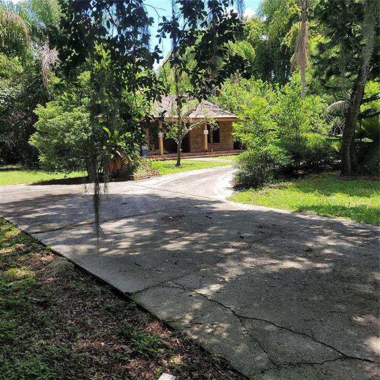 INVESTORS WANTED!!! MOTIVATED SELLER! PRICE DROPPED! 4.68 acres of land in Lutz (across from Avala II) is hard to find but this can also be subdivided with water frontage, easement is already there. Once a beautiful family dream home with 5 bedrooms, 2 baths, 2 car garage and out buildings is now available for sale to be brought back to it’s magnificence once again. Huge master suite, Stone fireplace, in ground pool, too much to mention, you must see. In 2014 partial REROOF county permit records. Oh and bring your horses! Don’t miss out on this opportunity. AS IS, WHERE IS. Cash buyers only! $680,000. There is currently a legal issue being handled by the attorney which makes a closing date unknown at this time.
