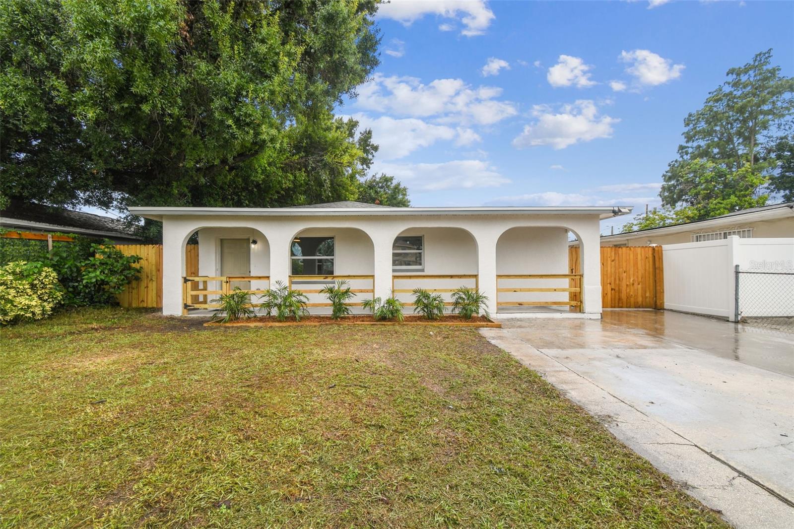 Welcome to your dream home in the heart of West Tampa! Step into this impeccably maintained, move-in-ready gem, ideally situated in one of Tampa's most desirable and centrally located neighborhoods, right next to Raymond James Stadium. Starting with a welcoming front porch, perfect for savoring your morning coffee or unwinding after a long day. Inside, discover a beautifully designed 4-bedroom, 3-bathroom residence plus a versatile bonus room that can serve as a home office, den, playroom, or even a fifth bedroom. The spacious living room invites you in with an eye-catching modern accent wall, setting the tone for the stylish updates found throughout the home. To the right, you'll find the heart of the home, a thoughtfully curated and well-maintained kitchen featuring sleek stainless steel appliances, ample cabinetry, and a generous separate dining area perfect for family meals or entertaining guests. As you continue toward the back of the home, you’ll appreciate the flowing tile and laminate flooring throughout, enhancing both elegance and easy maintenance. A standout feature of this property is the rare dual primary suites, each complete with private, updated en-suite bathrooms, ideal for multi-generational living, guest accommodations, or added luxury. The fenced-in backyard is an inviting space to host weekend barbecues, enjoy a quiet evening under the stars, or let pets play freely. A detached shed provides valuable extra storage. The home has been freshly painted inside and out, and a brand-new roof (2025) offers added peace of mind for years to come. This property is an amazing primary residence and also offers fantastic investment potential for rental/ Airbnb, with its generous square footage, versatile floor plan, and unbeatable location. No HOA. No flood insurance required. You're just minutes from: Raymond James Stadium (3 minutes away), George M. Steinbrenner Field (5 minutes away – current Tampa Bay Rays Stadium/NY Yankees Spring Training stadium), Midtown, Downtown Tampa, Tampa Riverwalk, Tampa International Airport, and Major highways for easy commuting. Whether you're looking to plant roots or invest wisely, this West Tampa treasure is the perfect place for you.