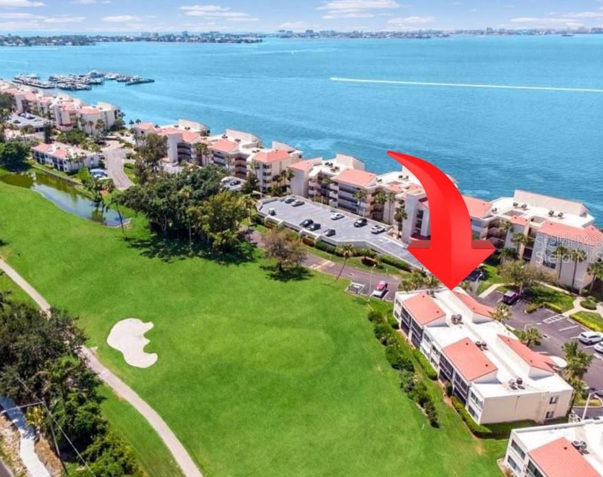 Exquisite FULLY FURNISHED 2-Bed/2-Bath 1st floor Condo Just Minutes from the Iconic Don CeSar Hotel, and UNTOUCHED by the hurricanes of 2024!!!-Welcome to your turnkey coastal retreat in the highly desirable waterfront community of La Puerta Del Sol — where luxury meets laid-back beach living. This recently remodeled condo radiates modern mid-century charm with stylish finishes and thoughtful upgrades throughout. Step inside to find a light-filled, open-concept layout that feels spacious beyond its square footage. The main living areas feature oversized ceramic tile flooring, while the bedrooms boast the warmth of rich wood flooring. The sleek kitchen is a chef’s dream, complete with high-end stainless steel appliances, gleaming quartz countertops, and an eye-catching stone backsplash that adds a custom touch. The spacious primary suite is your personal sanctuary, featuring a walk-in closet and a spa-inspired en suite bathroom with a luxurious rain shower and elegant backlit mirror. The second bedroom and full bath are equally inviting — perfect for guests or a home office. Additional highlights include: A/C system just over a year old, in-unit laundry, reserved and guest parking. Resort-style amenities including a waterfront pool, hot tub, place to launch kayaks and paddleboards, and tropical landscaping! Adjacent to The Isla Del Sol Yacht & Country Club offers opportunities for golf, tennis,  yacht, or social memberships. Investor-friendly opportunity! The current owner successfully operated this condo as a vacation rental, and January through March 2026 is already booked, offering instant income for the next owner. Perfect as a full-time residence, seasonal escape, or income-producing property. Located just minutes from world-famous St. Pete Beach, the historic Don CeSar Hotel, vibrant restaurants, shopping, and all the best of the Gulf Coast lifestyle. Don’t miss this rare opportunity to own a piece of paradise!