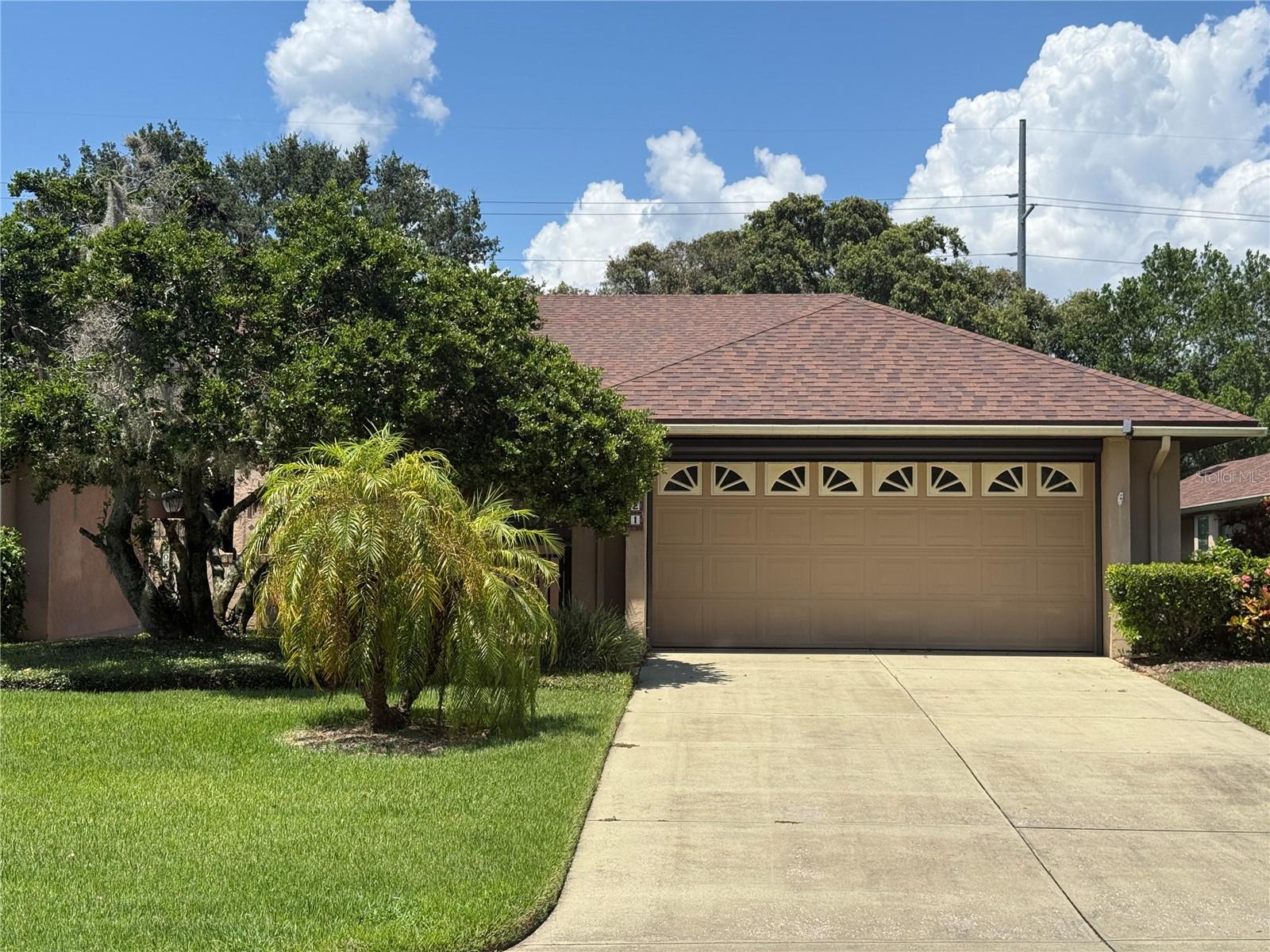 Enjoy this charming and welcoming home located in a vibrant neighborhood just minutes from downtown Mount Dora. One of only 30 custom-designed homes with private access to Lake Dora, this residence boasts with the mature landscape and 2018 roof. Inside, you'll find a beautifully upgraded interior with soothing colors, porcelain 'wood plank' tile flooring, granite countertops, and stainless steel appliances. The property features a two-car garage, an interior laundry area, and a serene backyard shaded by mature trees. The former railroad tracks behind the neighborhood are no longer in use, with plans underway to transform the area into an exciting bike and walking trail. The Vineyard community offers a low-maintenance lifestyle with full yard service included in HOA fee.