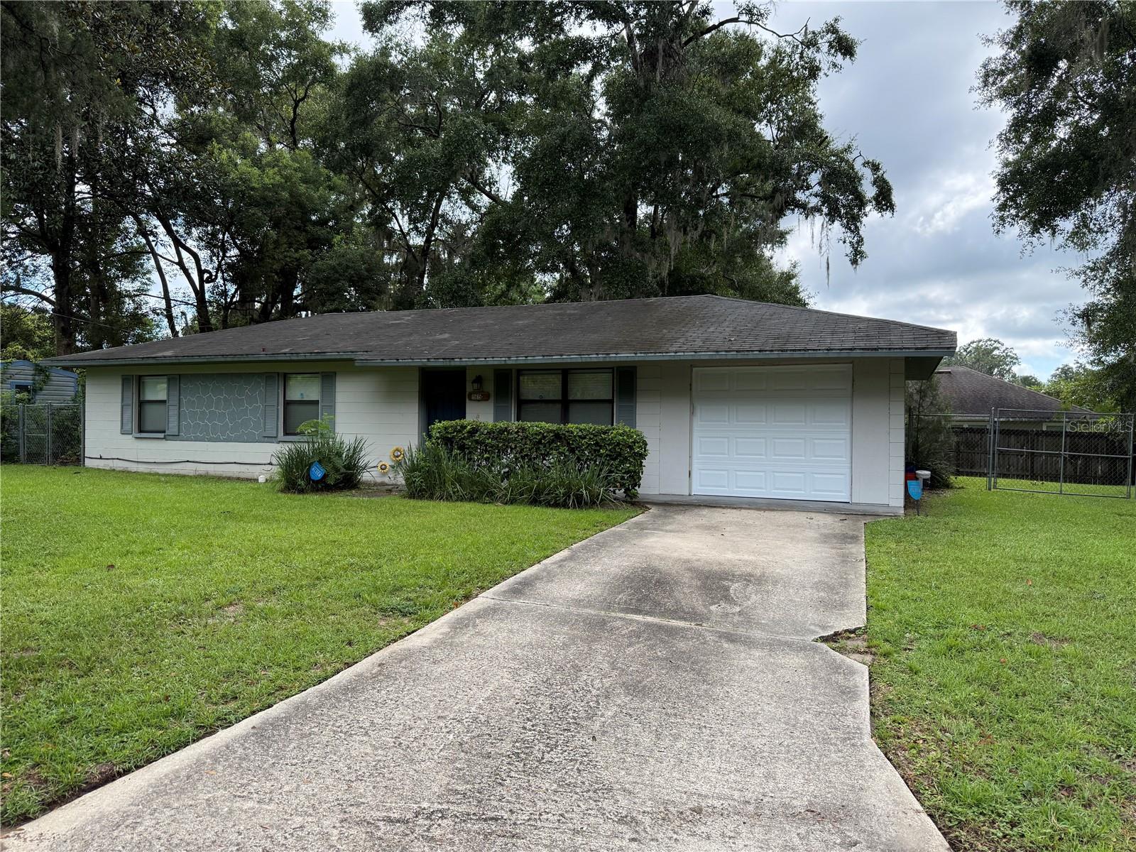 Welcome to this completely renovated 3/2 in the heart of the charming city of Alachua, FL. This home is nestled on a cul-de-sac street and boasts a modern, updated kitchen equipped with stainless steel appliances and beautiful quartz countertops. The living/dining room combination provides an open area for entertaining or relaxing. The home also features luxury vinyl plank flooring throughout. The bathrooms have been updated, enhancing the overall appeal of the home. Additional amenities include a 1-car garage, central heat & a/c, ceiling fans, and a laundry room with washer/dryer hookups. The property also comes with a chain link fenced backyard, perfect for outdoor activities. Plus, lawn service is included, providing you with more time to enjoy your new home. Experience the comfort and convenience of this beautifully renovated home in Alachua, FL.
1 dog, less than 25 lbs, is considered, subject to approval, with additional pet deposit. Breed restrictions apply. No cats.
1st month's rent, last month's rent and security deposit are required for move-in.
Initial lease term until July 30, 2026.