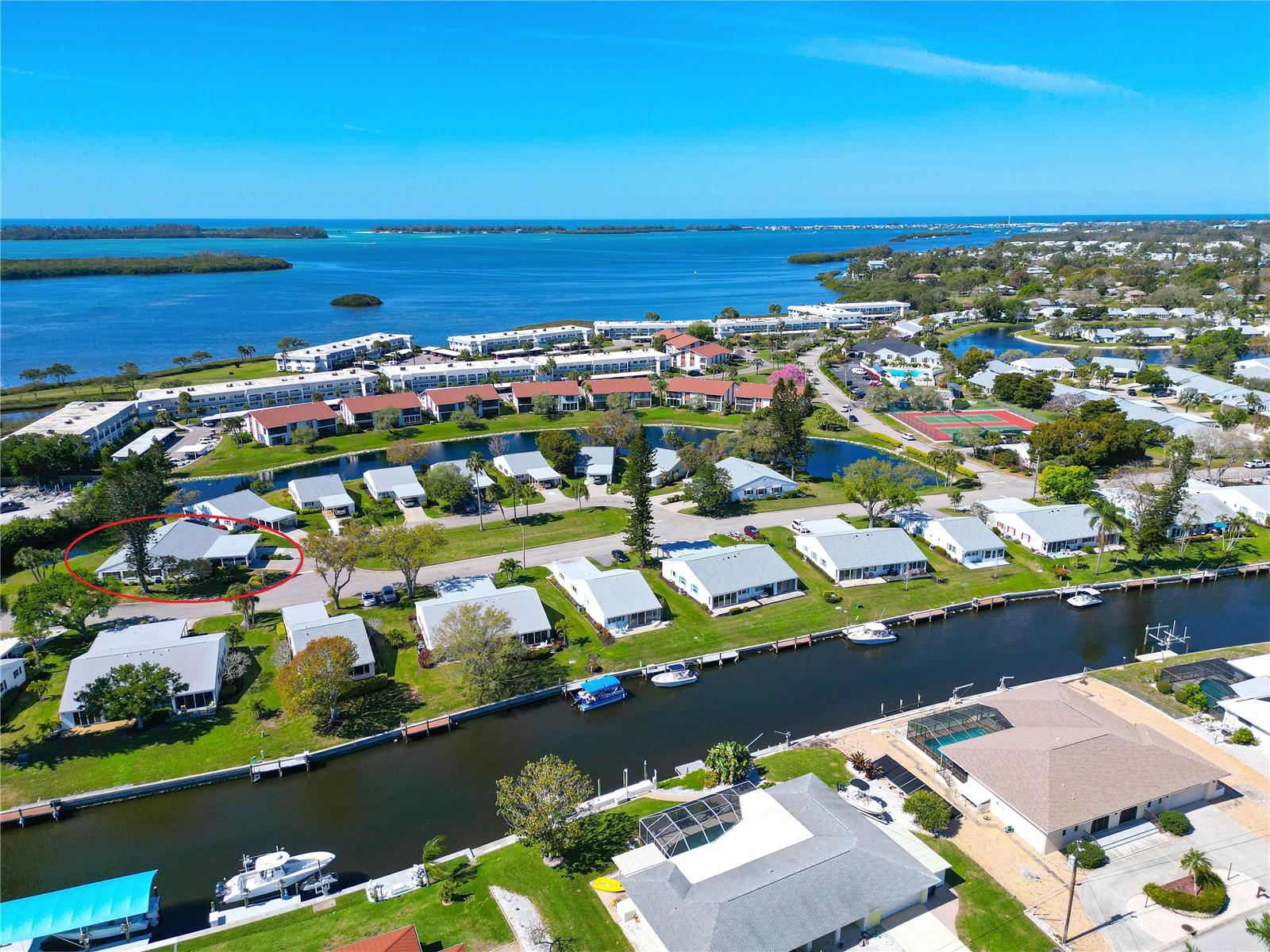 NESTLED WITHIN A VIBRANT, nearly 90-acre bayfront community, this delightful turnkey-furnished two-bedroom, two-bathroom concrete block villa with storm shutters offers the perfect blend of comfort, charm, convenience and peace of mind. Tucked away on a quiet cul-de-sac with serene pond views and surrounded by lush green lawns, this villa is just a short stroll from the exceptional clubhouse and resort-style amenities, you’ll be proud to call this your Florida home. STEP INSIDE AND DISCOVER the many updates that add to this villa’s value and peace of mind: 2025 water heater, 2024 air conditioning system, 2023 3rd nail hurricane roof reinforcement, 2023 GE stainless appliance suite, and 2023 ceiling fans. THE BRIGHT AND CHEERFUL great room opens to a private patio and scenic outdoors, offering a perfect setting for relaxing or entertaining. The home features a wide carport, newer driveway, secure outdoor storage (ideal for bikes, beach gear, or fishing equipment), and an indoor laundry space for convenient everyday ease. INSIDE YOU’LL FIND a thoughtfully designed open-concept layout with a split-bedroom floor plan for privacy and functionality. The spacious primary suite includes a large walk-in closet with attic access and an ensuite bath with creamy tile, shower safety bars, and coordinating vanity and fixtures. The secondary bedroom, located up front, has its own adjacent bathroom with a tub/shower combo and safety bar for easy entry. THE SPACIOUS KITCHEN is well-equipped with a complete GE stainless appliance package, abundant white on white cabinetry with updated hardware, generous countertops, and a convenient closet pantry, all topped off with modernized lighting and a tray ceiling installed in 2023. A pass-through to the dining area enhances flow for easy entertaining. The combined living and dining space offers versatility for your preferred layout and hosting needs. LOVE THE OUTDOORS? You’ll appreciate the cozy rear patio—extend it up to 27 feet across the back for even more living space—and consider adding a retractable awning for sunny days. Additionally, the shaded carport doubles as a welcoming front porch. You can grill and relax in both spaces. ENJOY PICTURESQUE COMMUNITY WALKING PATHS that wind past butterfly gardens, lagoons, lakes, and bayfront views, leading to a peaceful pavilion. For the socially inclined, it’s just a short stroll to the clubhouse and amenities galore. BOATING ENTHUSIASTS will love the boat docks and kayak storage—just a one-time $25 fee. While Mount Vernon is a pet-free community, service animals are welcome with proper documentation, and golf carts are permitted for residents with medical needs. COMMUNITY AMENITIES INCLUDE Clubhouse, banquet room, billiards, ping-pong, game/library room, lakeside veranda, heated pool, tennis, pickleball, shuffleboard, bocce, spa, sauna, workshop, putting/chipping green, butterfly garden, kayak launch & storage, bayside pavilion, bird sanctuary, and nature-filled walking trails across nearly 90 acres. MONTHLY DUES COVER water, sewer, trash/recycling, pest control, cable, internet, exterior and landscape maintenance, and insurance. START LIVING YOUR DREAM and embrace the blissful Florida lifestyle. Schedule your private tour today!