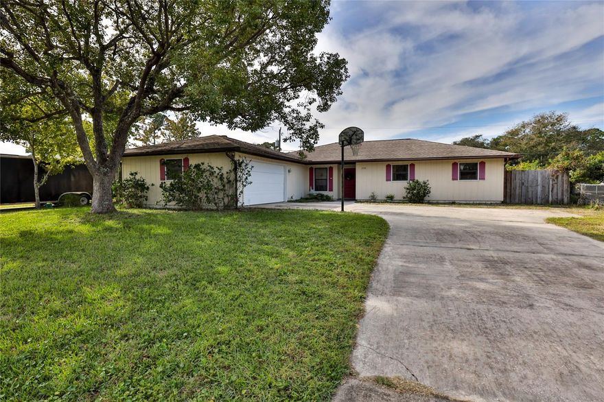 Plenty of Comfort and Joy in this welcoming home.  Spacious open floor plan, with lots of natural light. As you enter the home to the right you will find the Large bedrooms with plenty of closet space. 3 bedrooms 2 bathrooms, one bath off Hall. the other an ensuite to the master bedroom. To the left you have the dining room and kitchen off the kitchen you will find Laundry room, large utility room  that houses the HVAC system and hot water heater but with plenty of extra room for storage. The AC system is newer  unit with UV light purifier. The living room is spacious with a fireplace and sliding doors to the patio.   Driveway large enough for several cars and a boat or camper and plenty of room in the 2 car garage for you cars or toys. Fenced yard with inground  pool with screen enclosure but the pool needs work listing price reflects the work needed. Roof 2004
measurements presumed to be accurate but should be verified ;Water: City