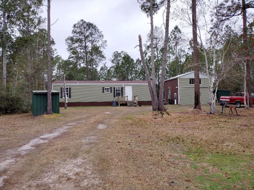 Affordable 2020 Single Wide on 165x300’ Country Lot – Workshop, RV Hookup & Farm Animals Welcome!  Looking for an affordable, move-in-ready home with room to spread out? This 2020-built single wide mobile home offers 660 square feet of efficient living space with 2 bedrooms and 1 bath, making it perfect for a small family, first-time buyer, downsizer, or investment opportunity.  Step inside to an inviting open floor plan featuring a bright living area, breakfast bar, and eat-in kitchen space—ideal for casual dining and entertaining. The smart layout maximizes every square foot, creating a comfortable and functional living environment.  Enjoy your morning coffee or unwind in the evening on the front deck, overlooking your spacious 165x300’ county lot. With plenty of room for outdoor living, gardening, or recreational vehicles, this property offers true country freedom.  The two-story workshop is a rare bonus—complete with electric, water, and a concrete floor—perfect for hobbies, storage, small business use, or additional workspace.  If you’re searching for affordable country living with land, outbuildings, and room for animals, this property checks all the boxes. Plenty of space for your RV, work trucks, toys, or future improvements.  Schedule your showing today and discover the possibilities for this versatile property.
