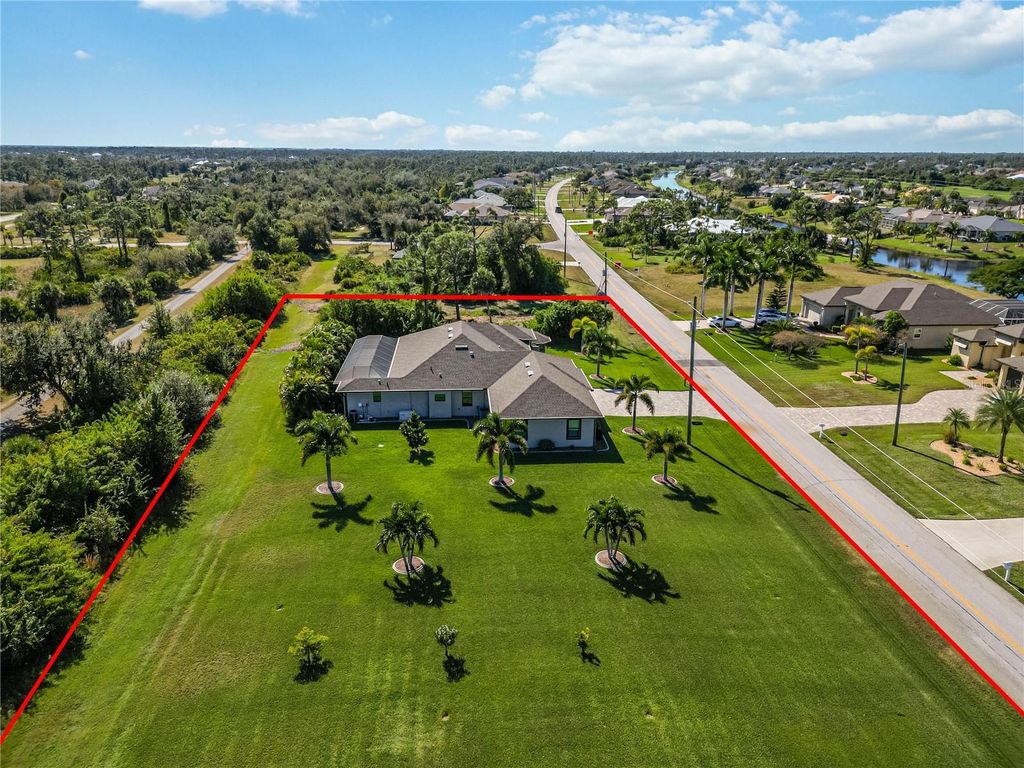 Photo of 959 Boundary Boulevard, Rotonda West, FL 33947 (MLS # D6144747)