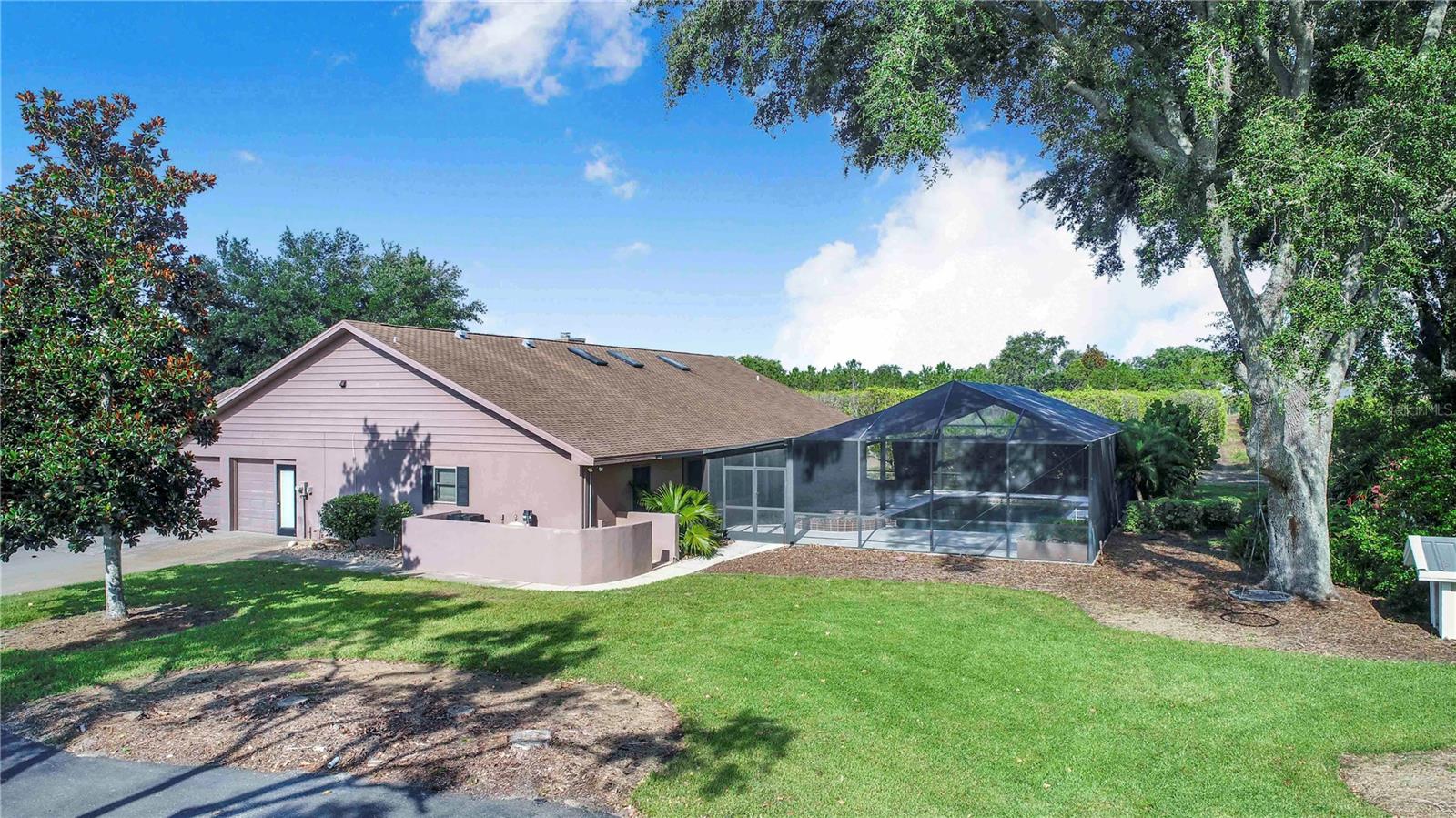 Discover the perfect blend of privacy, space, and functionality with this unique property! This well-maintained home features an open floor plan with ceramic tile throughout, a cozy fireplace, and a spacious kitchen complete with granite countertops—ideal for entertaining. Step outside to enjoy the large screened-in pool area, perfect for Florida living.
What truly sets this property apart is the massive 60x40 detached shop, which includes a dedicated office space, offering endless potential for business, hobbies, or storage. Situated on a private lot with no close neighbors, this home is a rare find that offers peace and seclusion while still being conveniently located.
