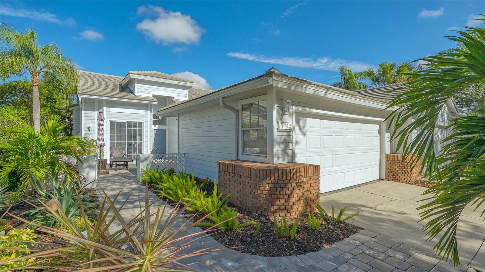 This beautiful 2-bedroom, 2-bathroom villa in the award-winning University Park Country Club is move-in ready and offers an exceptional blend of comfort, style, and outdoor living. The villa is located in the desirable Whitebridge Court neighborhood, known for its maintenance-free living and community pool.
As you enter the property, a pavered courtyard welcomes you, providing the perfect space for entertaining and relaxing. The front entrance, featuring glass sidelight and transom windows, opens into a spacious and well-designed living area with tile floors throughout. The kitchen, updated just a few years ago, boasts beautiful quartz countertops, new appliances, and a breakfast bar. A double slider from the kitchen leads directly to the courtyard, further enhancing the home’s connection to the outdoors.
The dining room is illuminated by modern lighting and offers a charming window seat, while the living room features triple sliders that lead to a glass-enclosed lanai—ideal for enjoying the beautiful Florida weather year-round. From there, quad-sliders open to an additional screened lanai that provides breathtaking lake views , creating the perfect setting for outdoor relaxation and entertainment.
The spacious primary bedroom includes a private sitting area with scenic lake views. The ensuite bathroom features double sinks, a walk-in shower, quartz countertops, and a large walk-in closet. The guest bedroom also offers access to the courtyard through a double slider, complete with an automated sunscreen for added comfort. Guests will enjoy a private bath with a tub/shower combination and quartz countertops. For additional privacy, the guest area can be closed off with double doors.
The home also includes a large closet with newer washer and dryer, ceiling fans throughout, and serene paint colors that complement the peaceful surroundings. The property is beautifully landscaped and has been updated with the roof, air conditioner and hot water heater all replaced in 2019/2020.
This villa is a perfect blend of modern amenities and outdoor enjoyment, with entertainment spaces both at the front and back of the home. Enjoy all that University Park Country Club has to offer, with easy access to the golf course and a community pool just steps away. Don’t miss this opportunity to make this lovely villa your new home!
University Park Country Club is consistently ranked one of the top courses in Florida featuring 27 holes of championship golf; tennis and pickleball; fitness center, croquet – as well as an array of social and group activities. Just a 15-minute drive outside this peaceful enclave is downtown Sarasota, with shopping, arts & theatres, museums, dining and entertainment, top-ranked healthcare, beaches and SRQ International Airport. Two miles east of UPCC is the convenience of I-75, University Town Center with 300 nationally known and homegrown shops, restaurants, fitness studios, services and attractions and the Nate Benderson Park, home of world-class rowing events. Enjoy the club amenities with the required minimum of a Social membership at UPCC, which is owned by the residents through a Recreation District.