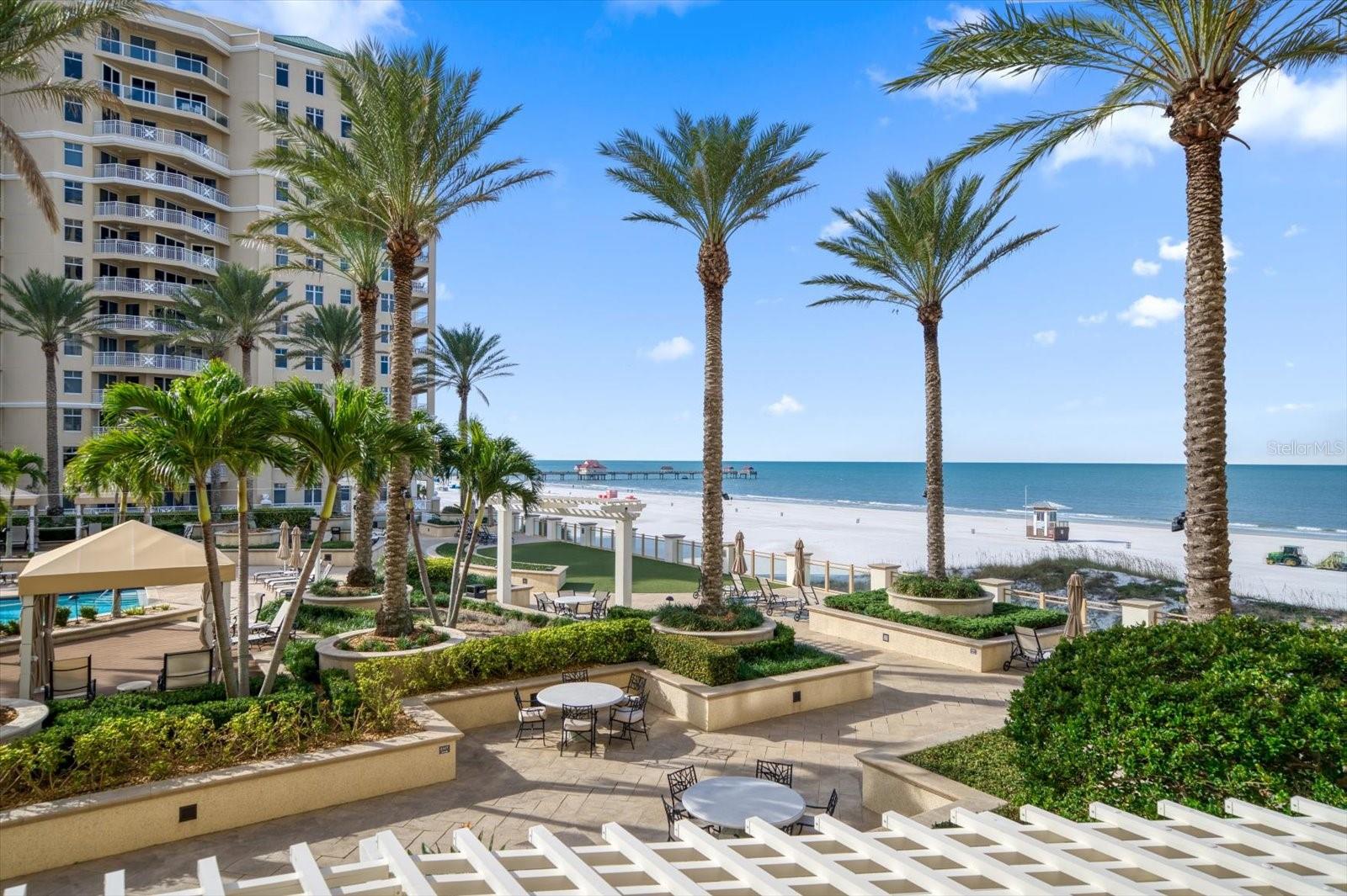 Step into a world of modern luxury seamlessly blended with the tranquility of nature in this stunning, newly remodeled condo on Clearwater Beach. This unique design that artfully combines cutting-edge sophistication with organic eco-conscious allure. With over $400,000 recently invested in the breathtaking transformation, you’re welcomed by a foyer entry to an elegant interior offering Restoration Hardware /fixtures, Italian marble floors, a custom chef’s kitchen with a grand waterfall peninsula, Quartzite counter/backsplash and top-of-the-line appliances (Miele/Sub-Zero/Monogram). Entertain in an open floor plan with a dining area, a large living area and a seamless segway to the gracious terrace beyond. This beautifully appointed outdoor retreat overlooks the pristine sandy beach and tropical grounds, with captivating sunsets and large windows that connect to the light-filled living spaces. An opulent private master retreat delivers the perfect escape, along with an opulent bath, custom closet and terrace access. Carefully curated bathrooms offer marble and natural onyx, along with refined finishes, lighted mirrors and spa-influenced finishes. Offering a sanctuary ideal for those who cherish life's finer perspective of home, this rare opportunity combines sustainable living and modern sophistication with refined amenities and fixtures. A commitment to sustainability includes eco-friendly paint throughout. Featuring a high-efficiency air conditioner with purifier, along with a new washer, dryer and smart water system, this home transcends mere living space. In one of the most desirable areas of Clearwater Beach, surrounded by breathtaking natural beauty and world-class amenities, experience the pinnacle of coastal luxury and the unmatched resort amenities of Sandpearl. Exclusive amenities deliver a resort lifestyle beyond compare. Live like you’re on vacation every day with a secured building, 24/7 Concierge, state-of-the-art fitness, beachside pool and more. Located in the heart of Clearwater Beach, you're minutes to fine dining, shopping, entertainment and nightlife on the world-famous sandy beaches. Perfect for a primary residence or vacation escape, this is the home you’ve been dreaming of.