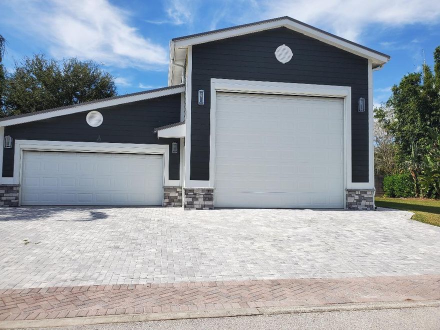 ZERO STRESS!  This uniquely custom designed RV Garage (48.11' x 20.11' MOL) with additional 2 car garage (19.6' x 19.2' MOL) and Cottage attached is all you will ever need whether you are retired, semi-retired or just vacationing. The list of amenities that accompany this property and structure are too numerous to list.  I have attached a break down of the design features of each room. This is beyond quality with top of the line products used in every inch of the building of this unique home away from home.  The tropical designed Woods is gated and offers a beautiful waterfront Clubhouse with a bar, tables/chairs, ice machine, bathrooms, refrigerator(s), large wall mounted TV, piano and private lockers to store your personal liquor.   The hot tub/conversation pool and swimming pool are part of the community features and amenities.    Take your golf cart to the upscale nudist Caliente Resort.  This is truly one of the most  beautiful nudist RV Parks you will find.  The adjacent vacant lot can be purchased as a package price at $575,000.  Call to schedule a private tour.