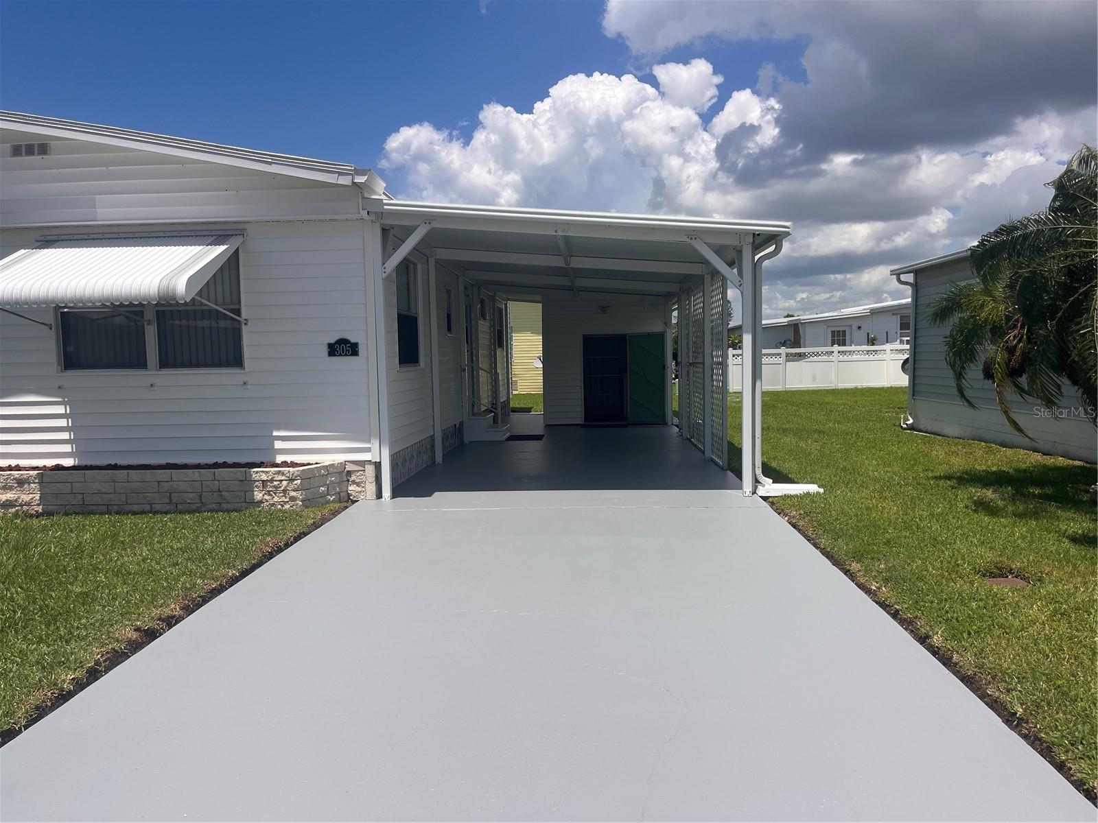 Nothing to do but move in. This 2bedroom 2 bath home has been completely redone by a professional who takes pride in their work. It has been redone from the subflooring up. Beautiful laminate flooring in the living areas and carpet in both bedrooms. The Florida room has tile flooring and has had a/c vents added for additional sq footage. Both bedrooms have in suit baths with the 2nd bedroom having a door directly into the second bath. Everything has been sanded and repainted, walls, ceilings, cabinets, inside and out, exterior, the driveway and the walkways. All new electrical outlets and switches. Entire property has LED lighting. the utility room has the washer and dryer plus a laundry sink. There is a new privacy fence on the west side of the property. All upgrades are available in the attachments for your review. This is truly ready to move into.