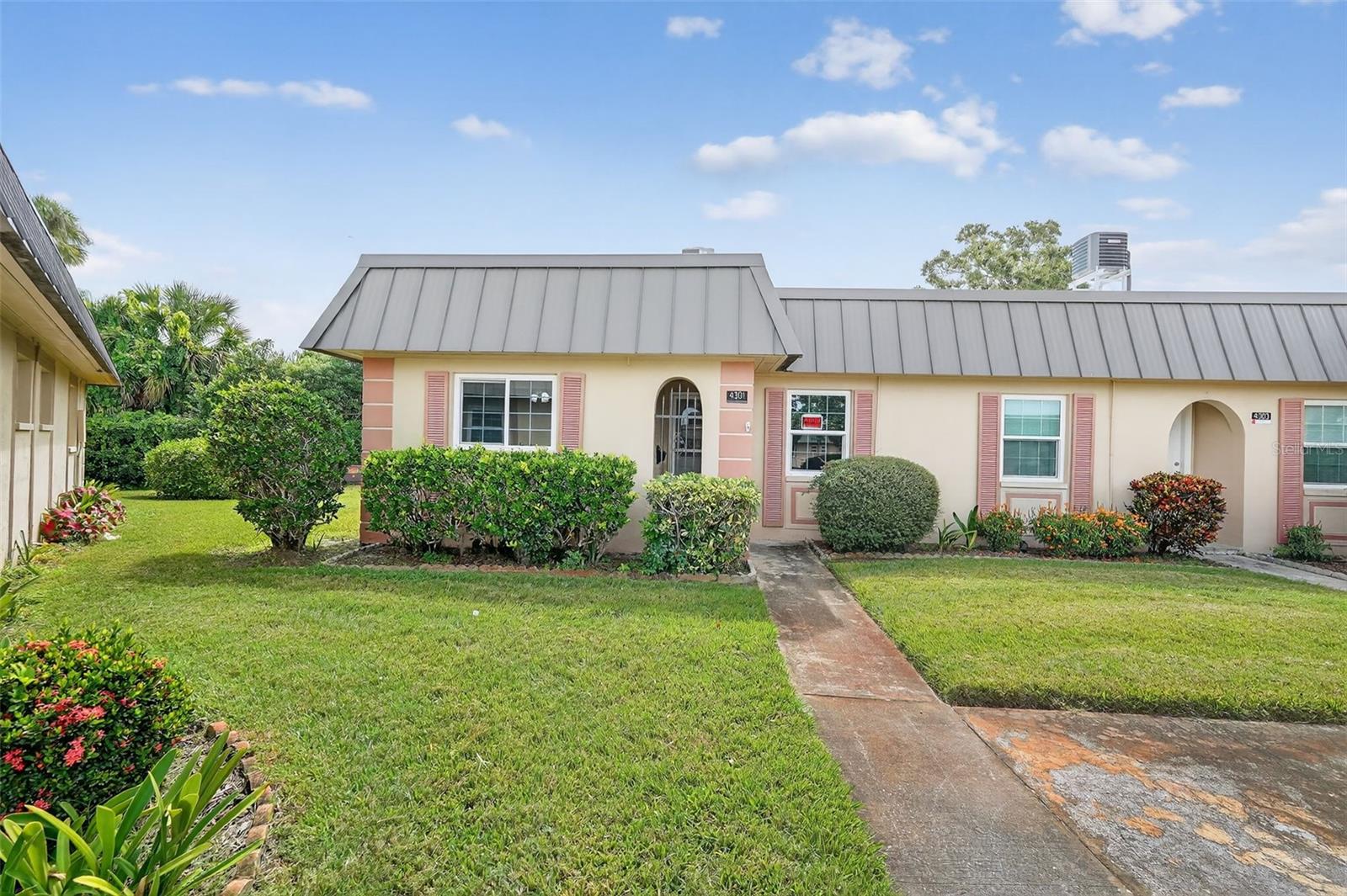 Welcome to Gardens of Beacon Square! This charming 2-bedroom, 2-bath condo offers easy living in one of New Port Richey's most established communities. With over 1,000 sq. ft. of living space, this home features a bright and open living and dinning area, and a cozy Florida room perfect for morning coffee or evening relaxation. The kitchen has been tastefully updated with modern finishes and plenty of storage. Both bedrooms are generously sized, and the primary suite includes an en- suite bathroom for privacy and convenience. Enjoy maintenance free living with exterior upkeep, landscaping, and community amenities all covered by the HOA. The community offers a clubhouse, pool, shuffleboard courts, and peaceful water views. A true Florida lifestyle at an affordable price. Conveniently located near shopping, dining, medical centers and just a short drive to Gulf beaches.