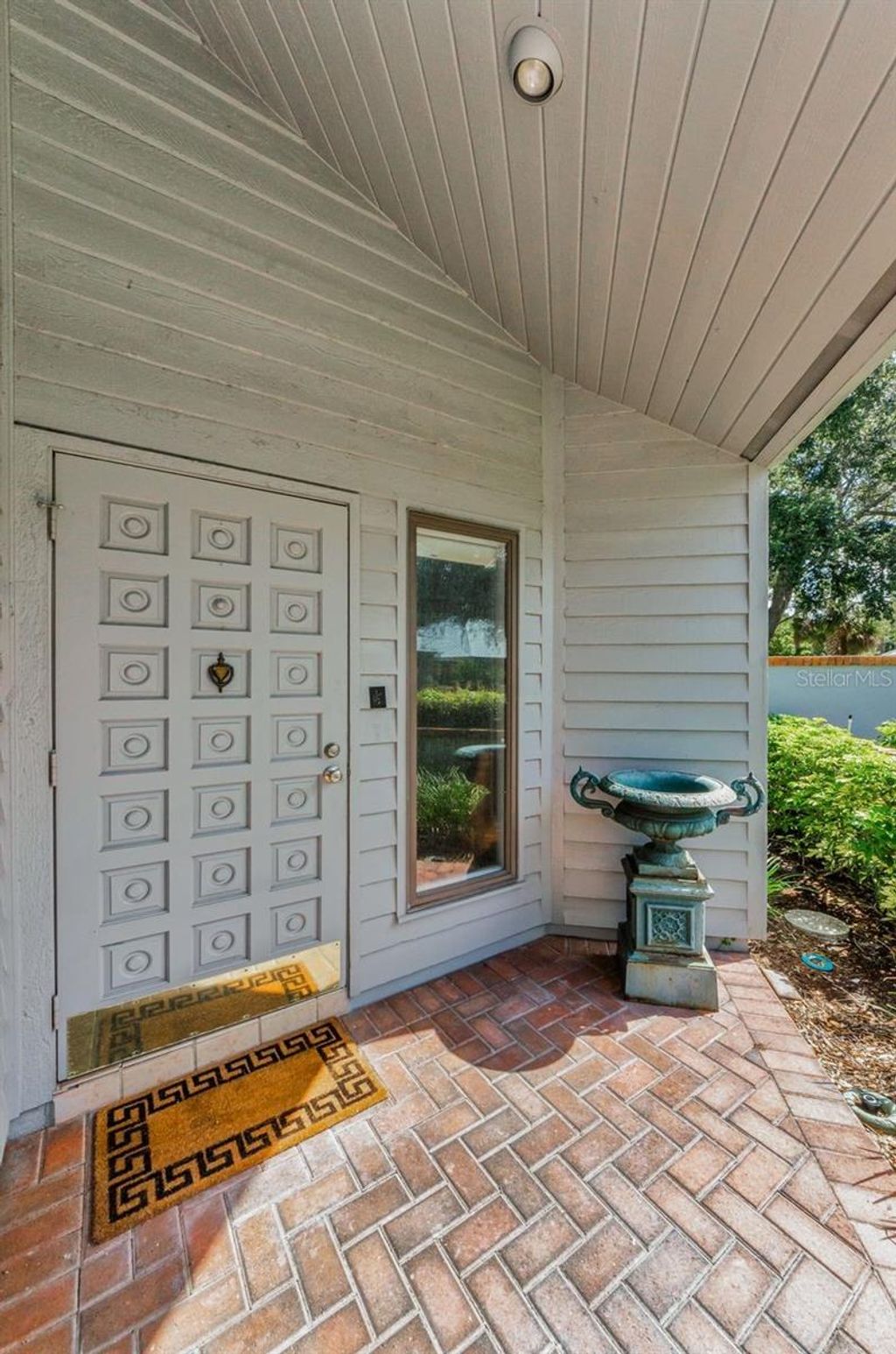 Photo of 10479 Longwood Drive, Seminole, FL 33777 (MLS # TB8408424)