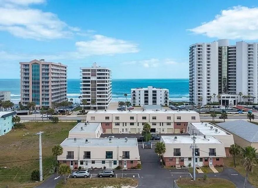 Walk to the beach and enjoy a stroll!! Well-maintained and remodeled 2 bedroom, 2.5 bathroom, condo in the heart of Daytona Beach Shores! A highly desirable community. Brand new kitchen with all new cabinetry, new appliances, new fresh paint, upstairs two primary bedrooms with primary suite bathrooms, with the rear room boasting a balcony looking toward the river. Assigned parking spot is included and condo association does allow for a short-term rental (30+). Plenty of shopping and dining nearby, and a bike ride to the beauty of Ponce Inlet and the Dunlawton boat ramp. Seize this opportunity to enjoy the beach life!!
