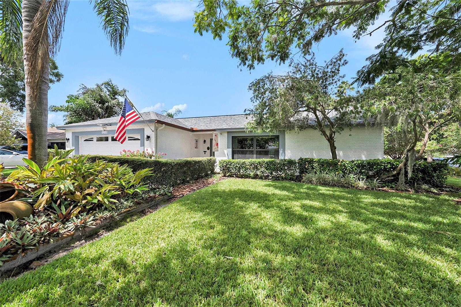 Welcome to your private tropical retreat in the heart of Countryway! Situated on a quiet cul-de-sac street, this stunning pool home sits on an oversized corner lot with lush, mature landscaping—offering exceptional privacy and the feel of a tropical island resort. Step inside to find luxury plank vinyl flooring installed in 2024 and fresh interior paint throughout. The updated kitchen features granite countertops, under-cabinet lighting, and a cozy eat-in space—perfect for morning coffee. Formal living and dining areas offer flexibility, while the warm and inviting family room includes a wood-burning fireplace. Need more space? The formal dining area easily converts back into a fourth bedroom or a private home office. Enjoy year-round relaxation in the large sunroom overlooking your backyard pool oasis. This spacious Florida Room features beautiful Saltillo Tile flooring making the room perfect for entertaining large gatherings or a quiet space to curl up with a good book! The resurfaced pool (2020) includes a new motor and filter, numerous water features and gorgeous lighting surrounded by lush landscaping and pool cage! The baths have been refreshed with the owners bath boasting a walk in shower and rain head! This home also offers major recent upgrades: a BRAND NEW ROOF (April 2025), HOT WATER HEATER (Nov. 2024), and HVAC air handler (2024) with a condenser just five years old. Most WINDOWS ARE IMPACT RATED for peace of mind and energy efficiency. All this in the highly desirable Countryway community with NO CDD FEES, plus access to dog parks, playgrounds, and Countryway Golf Club just minutes away. Don’t miss your chance to own this move-in-ready gem!