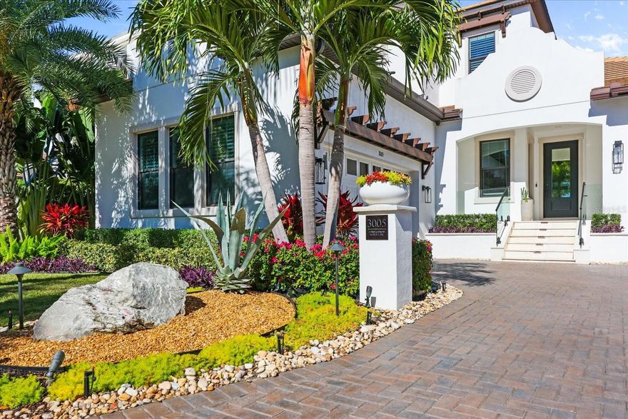 Forever Views! Whole House Generator! EV Charging! Elevator! Available Turn Key! Coastal luxury doesn’t whisper—it makes an entrance. Welcome to 3005 Christophers Watch in Antigua Cove, where elevated design, thoughtful engineering, and resort-level living converge in one unforgettable waterfront residence. Best of all, this home experienced no impact from recent hurricanes thanks to its prime elevation and location—a rare and valuable advantage.

Step outside and discover a $400K+ outdoor oasis designed to rival five-star resorts. Entertain effortlessly around your negative-edge heated saltwater pool and spa, complete with LED lighting and dream jets. Host unforgettable evenings in the fully equipped chef’s outdoor kitchen, unwind in the sunken conversation lounge overlooking the channel, or relax beneath the panoramic screened enclosure with custom lighting and audio. Every detail—from non-slip travertine pavers to lush privacy landscaping—has been meticulously curated over four years to create a private waterfront sanctuary.

Inside, sophistication meets functionality. Soaring 12-foot ceilings, designer lighting, and curated finishes set the tone throughout. The showpiece kitchen features double islands, quartz countertops, GE Café gas appliances, and elegant cabinetry designed for both beauty and performance. The first-floor primary suite offers a private retreat, while the elevator provides seamless access throughout the home. A flexible bonus space can easily transform into a fourth bedroom, executive office, or formal dining room—tailored to your lifestyle.

Boating enthusiasts will appreciate the 40+ foot dock (lift-ready) with direct access to Tampa Bay and the Gulf beyond—just 11 miles by water. Spend your days exploring renowned destinations like Shell Key, Egmont Key, and John’s Pass, or dock-and-dine at waterfront restaurants across Tampa and St. Pete.

Located within the gated Southshore Yacht Club, you’ll enjoy an unmatched lifestyle: resort-style pool, clubhouse, fitness center, pickleball courts, waterfront dining, marinas, and a vibrant, golf cart-friendly community atmosphere. This is more than a home—it’s a daily invitation to live exceptionally.

With transferable flood insurance at just $858/year and the option for most furnishings and a 6-passenger upgraded club car to convey, this is a rare opportunity.

Homes like this don’t sit—they’re claimed.
Schedule your private showing today and experience coastal opulence for yourself.