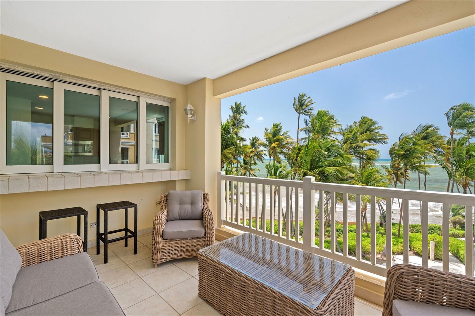 Experience coastal living at The Marbella Club in Palmas del Mar. This beachfront residence features 1,775 square feet of interior space on the fourth floor with expansive ocean views and direct beach access. The layout includes 2 bedrooms and 2.5 bathrooms, with one bedroom functioning as a lockout suite featuring a private entrance, ensuite bath, and a designated area ready for a kitchenette. Ideal for hosting guests or maximizing flexibility with short-term rentals permitted.
The property features one underground parking space, an assigned storage area, and the building is equipped with a full-power generator for added comfort and reliability. Monthly maintenance is $735 and covers building amenities and common area upkeep.
Residents of The Marbella Club enjoy beachfront pools, hot tubs, and beautifully landscaped grounds. Within the broader Palmas del Mar community, a wide range of amenities is available, including two championship golf courses, tennis and pickleball facilities, an equestrian center, a full-service marina, The Yacht Club, The Palmas Academy, dining, shopping, and miles of golf cart paths. Memberships and separate fees may apply for access to certain facilities.