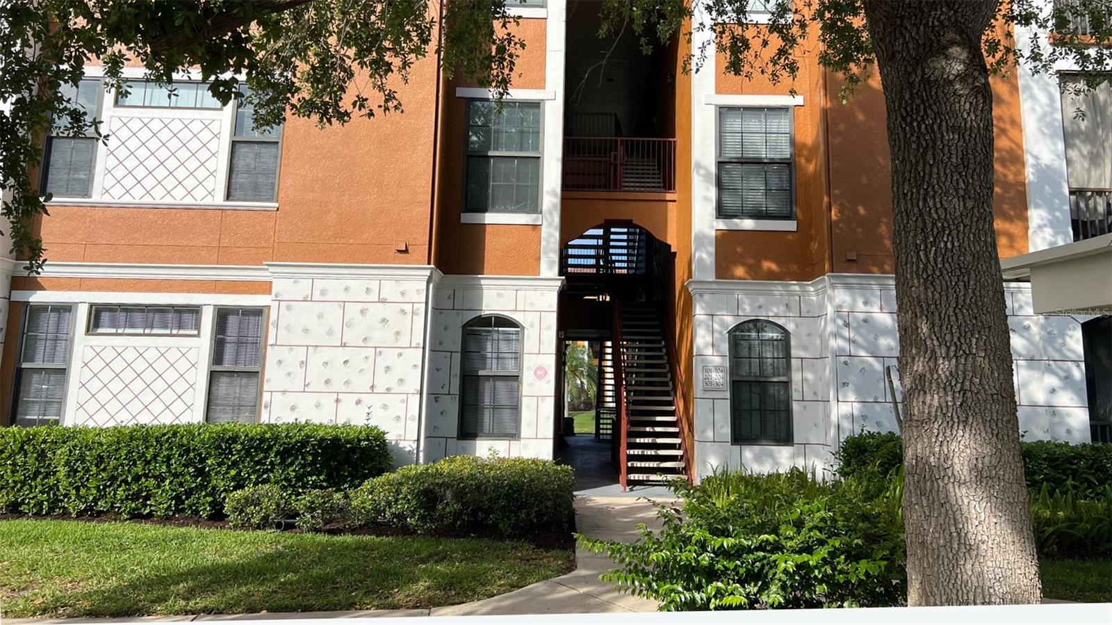 Rare opportunity to own one of the few three bedroom units in the award-winning landscaped, luxurious Serenata condominium homes. Split floor plan for privacy. All bedrooms have key lock door knobs for extra privacy. Upgraded fans. One of the few covered carport parking spaces is just outside of the unit's door and transfers with the condo. Serenata's gated community boasts resort style living. From the sundrenched pool, watch palm trees blowing in the breeze. Lighted tennis courts. Wifi in the game room, clubhouse & 24/7 fitness room. This first floor unit's living room has built-in shelves. Stainless kitchen appliances; upgraded fans & walk-in closets in all bedrooms; a screened patio for watching sunrises in outdoor tranquility has a walk-in storage closet. Boat spaces. Even valet trash service! Publix, Starbucks, CVS, veterinarians, eateries steps away. Farmers market; UTC Mall; Ringling; SRQ Airport; and I-75 less than 10 mins away. Downtown & St Armands 15-mins ride. This canvas awaits your design! Home warranty plan included at closing.