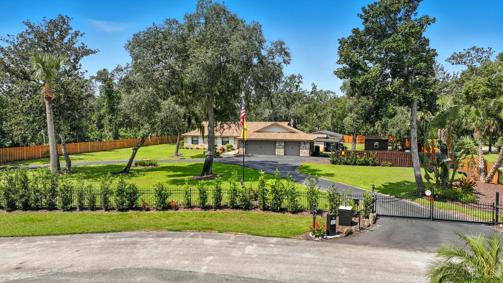 Welcome to 6248 Palomino, where location, privacy, and quality converge in this meticulously maintained gated estate on 1.08 high-and-dry acres. Nestled in one of Port Orange’s most sought-after areas and zoned for A-rated schools, this property truly checks every box on the wish list!
From the moment you arrive, the circular driveway and 3-car garage with attached carport set the tone for what’s inside—a home where extensive upgrades meet timeless design. Nearly every detail has been refreshed, including a new roof, updated HVAC with mini split in the office or 4th bedroom, and freshly painted garage floor. The pool area has been completely updated with a new surface, pump, heater, and deck, and the home is equipped with a whole-house Generac generator for peace of mind.
Step inside and you’ll love the spacious floor plan featuring new flooring, a warm and inviting living room with fireplace, and backyard views that lead to the covered outdoor living space with unique river rock flooring.
The kitchen and dining areas are a true gathering spot with extensive counter space, ample storage, newer stainless appliances, and a breakfast nook for casual meals. A large pantry and laundry room combo add even more functionality.
Down the hall, the guest bedrooms and primary suite offer comfort and style. The primary bath boasts a garden tub, walk-in shower, and dual vanities for a spa-like feel.
Outdoors, enjoy a sparkling pool, a full bath for poolside convenience, and a storage shed for all your extras—all surrounded by beautifully cleared and manicured grounds.
This home isn’t just move-in ready—it’s upgraded, elevated, and unforgettable. Whether you’re seeking space, privacy, or luxury living, you’ll find it all here at 6248 Palomino.
Schedule your private tour today and experience why this Port Orange estate is the one you’ve been waiting for!