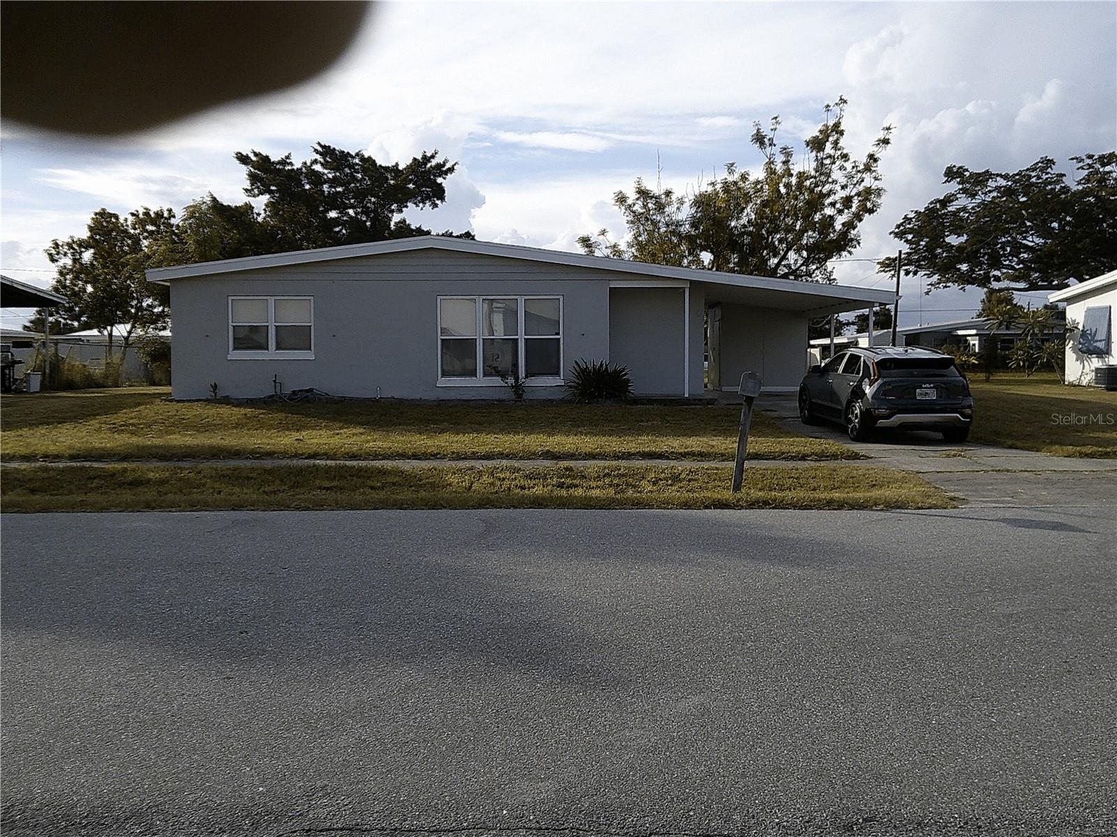Don't miss out on this 2 bedroom, 1 bath home with a carport in a quiet neighborhood in Port Charlotte. Close to stores, restaurants and entertainment. This delightful home combines convenience and charm making it an ideal choice for those looking for a cozy manageable space, Call today!