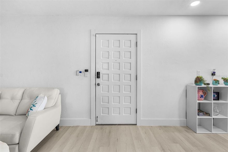 Experience the best of waterfront living in this completely renovated first-floor condo located just minutes from downtown Cape Coral. Every detail has been thoughtfully updated to provide comfort, convenience, and modern luxury. Enjoy serene canal views from every room and your enclosed lanai, just steps away from the community pool. The impact glass windows and sliders offer peace of mind, while a Simply Safe Security System and Nest thermostat—both accessible remotely from your smartphone—ensure ease and safety wherever you are. Inside, luxury vinyl flooring flows throughout the open layout. The fully renovated kitchen showcases premium Samsung smart appliances, including a refrigerator with a separate beverage drawer, internal ice maker, and water pitcher dispenser, as well as a smart range and microwave—all controlled from your phone. Recessed lighting and modern fixtures add a sophisticated touch. Both bathrooms are completely updated with elegant glass shower doors, Bluetooth speaker fan systems, and stylish backlit mirrors. The master bedroom features a spacious walk-in closet, while ceiling fans from Dan’s Fans—each remote-controlled or smartphone-operated—keep every room perfectly comfortable. Additional highlights include a new Rheem tankless water heater, an in-unit washer and dryer, and a turnkey option for immediate move-in. Boating enthusiasts will love the private boat slip—available for just $100 per year—with lift installation capability and room for up to a 30-foot powerboat or sailboat with a 4-foot draft. With no bridges and direct Gulf access, your boating adventures begin right outside your door. The clubhouse offers additional amenities, including a large pool, outdoor grill and dining area, bathrooms, showers, and extra laundry facilities. Located only 24 minutes from Fort Myers Beach and 29 minutes from Sanibel Island, this condo offers the perfect blend of coastal convenience, modern smart-home living, and relaxed waterfront charm.