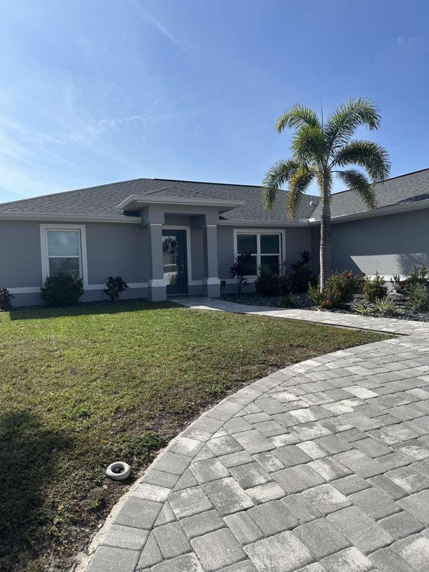 Beautiful 3 bedroom 2 bath with office(being used as 4th bedroom). Canal home with sailboat access only 5 minutes to open water of Charlotte Harbor. Completed in December of 2019. Open floor plan with with wood plank ceramic tile through out the house. Kitchen and both baths have quartz countertops. Large master bedroom with his and her walk-in closets. Master bath with double sinks,soaking tub and walk-in shower. Master has coffered ceiling and French doors leading to the lanai. Ceiling fans in all bedrooms,great room and lanai. Pavered lanai and saltwater heated pool with sun shelf. Beautiful outdoor kitchen. 45' concrete dock with 10,000 lb. covered boat lift. Circular paver driveway and oversized two car garage 24x26. This gorgeous home has impact windows and doors. This tropical paradise has sought after southern exposure.