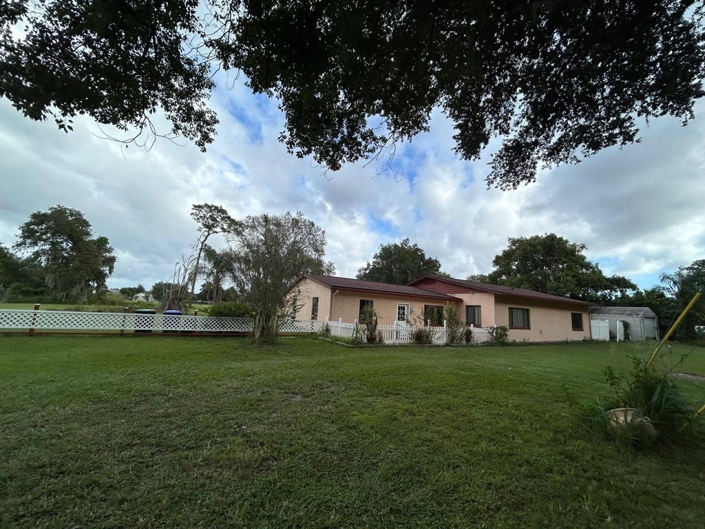 Photo of 10100 Alcock Road, Orlando, FL 32817 (MLS # O6451260)