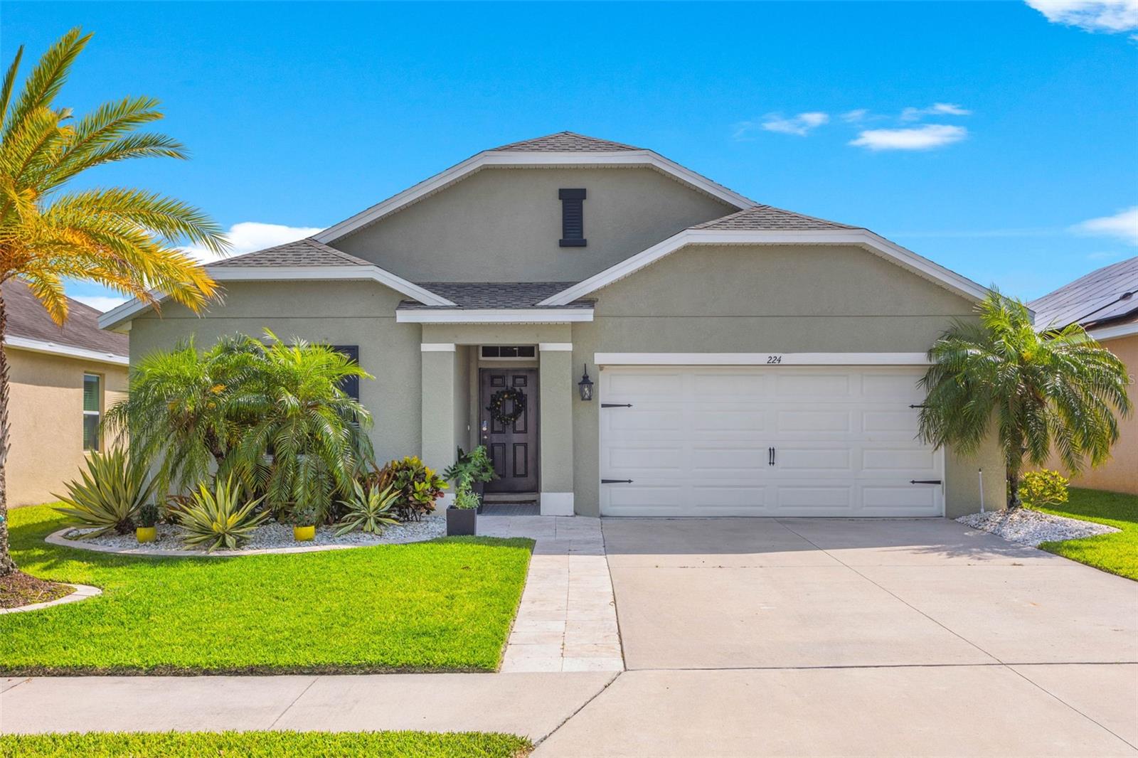 Meticulously maintained with designer touches and updates throughout, this four bedroom, two bathroom home is situated on a picturesque waterfront lot in the GATED community of beautiful Del Tierra! You'll immediately notice the curb appeal with an expanded driveway with beautiful travertine pavers and custom tile. The kitchen is the centerpiece of the home and a chef's delight featuring custom cabinets, herringbone backsplash, quartz counter tops, Bosch appliances, custom hardware, pendant lighting and an awesome custom island. The owners suite features a nicely appointed ensuite bath with quartz countertop, dual vanity, a custom shower with bench seating, tile from floor to ceiling, built in shelves, and rainfall shower. This home is set apart from others! It is model perfect loaded with expensive updates including crown molding, shiplap, wood planked tile floors, New ROOF 2023, New FENCE 2023. It's an entertainers delight featuring an expanded lanai overlooking the beautiful lake and fenced yard. Del Tierra community features a resort style pool, exercise room, playground, small soccer field, and miles of areas to walk and ride bikes. Located 30 minutes from the beach, close to shopping, schools, and I75.