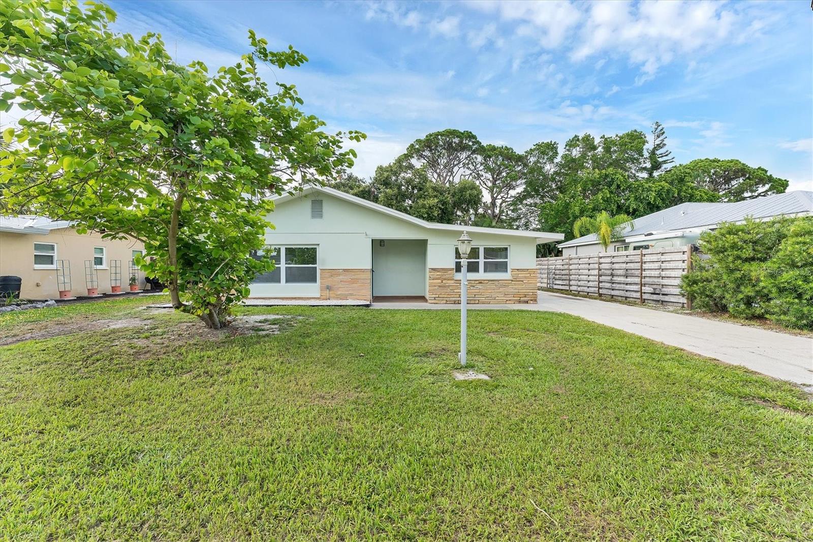One or more photo(s) has been virtually staged. Your Remodeled Oasis!
Discover your dream home at 2837 Yorktown St, Sarasota, FL, 34231! This freshly remodeled 4-bedroom, 3-bathroom residence offers modern luxury and peace of mind.
Step inside to find stunning honey oak vinyl floors that flow throughout the open living spaces. The kitchen has crisp white shaker cabinets, gleaming stainless steel appliances, and a spacious granite bar perfect for casual dining and entertaining. Looking to customize? Pick your kitchen backsplash and the seller will install it! Both the interior and exterior have been freshly painted.
This exceptional home boasts two primary bedrooms, each featuring its own en-suite bathroom, providing ultimate comfort and privacy. The main primary suite has a generous walk-in closet and a convenient private exterior entrance.
Enjoy year-round comfort and security with impact hurricane-resistant windows. Cozy up on cooler evenings by the charming wood-burning fireplace. Practical updates abound, including newer waterlines, a newer tankless water heater, PVC drains, a nice shed outside for storage and lots of paved areas for enjoying the private yard . For added convenience, there's an interior laundry room that comes with new laundry machines.
The entire property is secured with a chain-link fence, offering privacy and space for outdoor activities. This home is connected to county SEWER, so rare for the Gulfgate area. Don't miss the opportunity to own this meticulously updated Sarasota gem! 10 minutes to Siesta key and check out the wonderful Gulf gate shopping centers within minutes of this home.