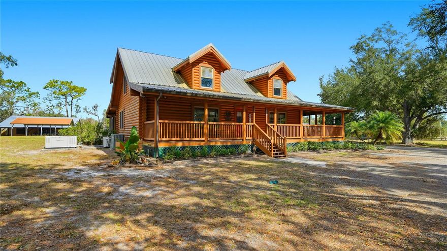 Three-bedroom, three-bath Heritage log home with 8" slow growth eastern pine logs on just under 5 acres.  Featuring a resort-style saltwater pool with waterfall, underwater lighting, in-pool seating, and propane fire pit, all overlooking a spacious 20’ x 40’ covered lanai. High ceilings, private office, and expansive wraparound porch enhance the home’s charm and functionality.

Set on 4.5 fully fenced acres with automatic ornamental driveway gate, the property includes a 4-car detached garage, barn from 1952, carport, stocked pond, and a 25 kW whole-home generator with a 500-gallon buried, owned propane tank. Zoned for horses and livestock, with 3-rail wood fencing and wire fencing ideal for pets.

Enjoy peaceful country living in Sarasota with convenient access—approximately 15 minutes to I-75, 25 miles to Siesta Key Beach, 22.5 miles to Lido Beach, 22 miles to St. Armands Circle, 13.5 miles to Waterside Lakewood Ranch, and 17.5 miles to UTC Mall.