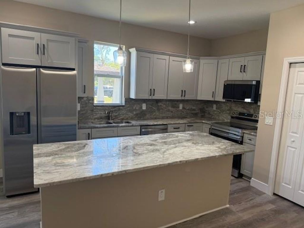 Photo of 8605 N 48th Street, Tampa, FL 33617 (MLS # TB8433811)