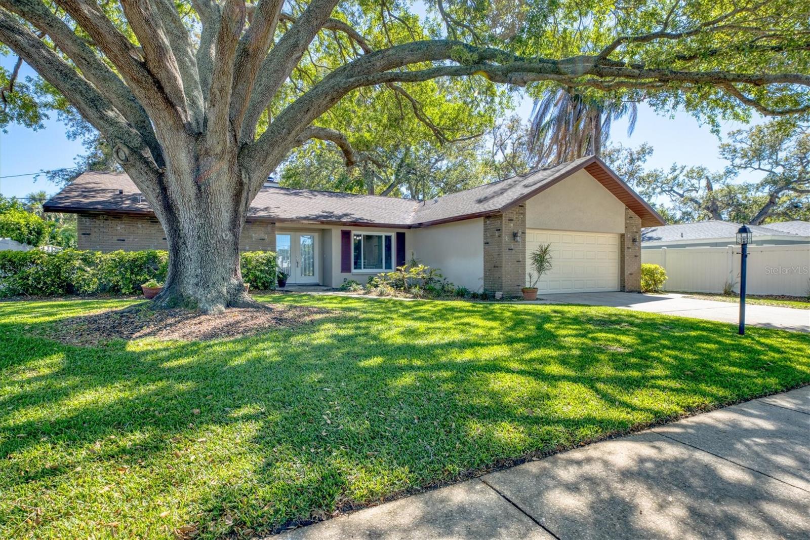 AVAILABLE JULY 15th through October ONLY. 1 MONTH MINIMUM. NO PETS, NO SMOKING. This beautifully remodeled 3-Bedroom 2 bath fully furnished home is ready for you! High & Dry Non-Evacuation Zone! Located just 5 minutes from the Gulf beaches, this spacious and stylish home offers soaring ceilings with stained pine ceilings, modern fireplace, NEW carpet in living room/master bedroom, NEW LVP in the rest of the home, NEW furniture, NEW lighting, NEW fans and NEW privacy front door. The great room includes an adjoining sitting area and an inviting sunroom filled with natural light. The kitchen is finished with quartz countertops, new soft-close wood cabinetry, Samsung stainless steel appliances (2020), a large stainless sink, and a bar/coffee station. Both bathrooms offer spa-like finishes with walk-in showers, granite countertops and 42" high dual vanities. The master suite includes a walk-in closet and an adjoining master bath for comfort and privacy. Your guests will appreciate the split plan with adjoining bath in the middle and both bedrooms are furnished with queen-sized beds. Additional features: Inside laundry room with oversized Samsung washer/dryer and utility sink, Updated garage door with WiFi-enabled opener, Window blinds throughout, Vinyl privacy fencing, 4-zone irrigation system. This home offers comfort, style, and an unbeatable location in one of the area’s most desirable neighborhoods. Don’t miss this opportunity—schedule your tour today! RATES VARY ON LENGTH OF LEASE.