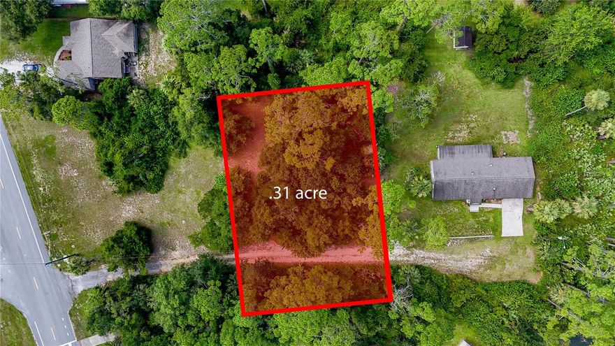 Build Your Coastal Dream in Flagler Beach! Imagine designing your perfect retreat just steps from the Intracoastal Waterway and moments from the Atlantic Ocean. High & dry, with the coveted Zone X designation! Use any builder with no time frame to build! With nearly a third of an acre(.31 acres) to build on, this oversized parcel can fit a wide array of floorplans and designs! Private location, but do not let this country setting fool you because you right in the heart of Flagler beach! This unimproved parcel offers the rare flexibility to be purchased individually or combined with two adjacent lots, creating over 1.13 acres of endless possibilities! Whether you envision a multi-generational compound, a spacious single-family home, or a coastal getaway, the location is unmatched—close to unique shops, local dining, boat ramps, scenic trails, and the laid-back Flagler Beach lifestyle.