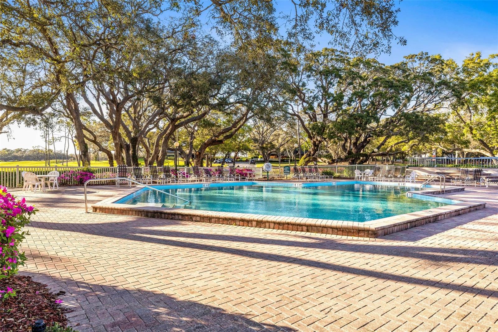 One or more photo(s) has been virtually staged. Live where others vacation! This is your opportunity to own a first-floor condo in the heart of the prestigious Innisbrook Golf & Country Club, where resort living is your everyday reality. Located in the sought-after Carnoustie building, this unit offers direct access to the parking lot, ice machine, and a scenic backyard golf course view—arguably one of the best spots in the entire community. The building features a new roof and has been meticulously maintained. Inside, you’ll find three spacious bedrooms with large closets, including a primary suite that boasts a massive bathroom and a generous walk-in closet. The open living area flows seamlessly into the front patio, offering a great space to relax or entertain.
This condo is perfect as a full-time residence, vacation home, or investment property, with both short- and long-term rental options available. The monthly condo fee covers water, sewer, cable TV, internet, trash, parking, pest control, access to laundry facilities, and 24/7 gated security. Innisbrook offers a lifestyle like no other—four championship golf courses (home of the Valspar PGA Tournament), top-tier tennis courts with on-site pros, resort-style pools with water slides and family activities, and complimentary transportation throughout the property. The 4,800-square-foot fitness center features group classes and personal training, while the full-service spa provides luxury treatments including hair and nail services. Dining is a treat with on-site steakhouses, casual poolside bars, and more. You’ll never need to leave—everything you need is right here.
Please note: GPS may not direct you to the correct building. At the gate, ask for a resort map and head toward the Islands Clubhouse. The Carnoustie building is on the right; unit #2332 is on the first floor, just to the left of the main entrance. Don’t miss this rare opportunity to own in one of Palm Harbor’s most exclusive resort communities!