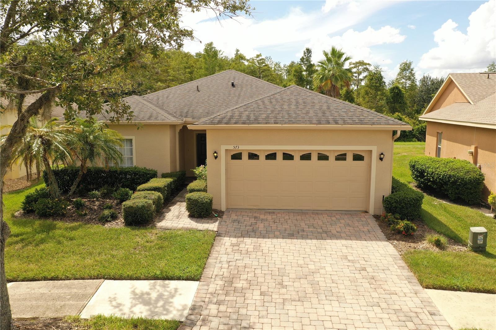 Exceptionally maintained Concerto model in the desirable 55+ community of Solivita — Flora Vista subdivision. This beautifully laid out 2 bed + den / 2 bath, split-floor plan home offers ~1,340 sqft of living space on a deep conservation lot, delivering both privacy and serene views. Inside you’ll find laminate flooring in the foyer, living, dining & hallway; ceramic tile in the kitchen & baths; cozy carpet in bedrooms & den. The kitchen features GE fingerprint-resistant slate appliances (2018), New cabinets installed in 2024, New A/C in 2022 and new roof (Feb 2018) ensures peace of mind. Enjoy Florida living on the oversized & extended lanai—part covered, part open—for both sun & shade. Energy-efficient touches include tailored foam insulation in exterior cinder-block walls, radiant barrier in the attic, plus hurricane panels and ceiling fans throughout. A must-see home!