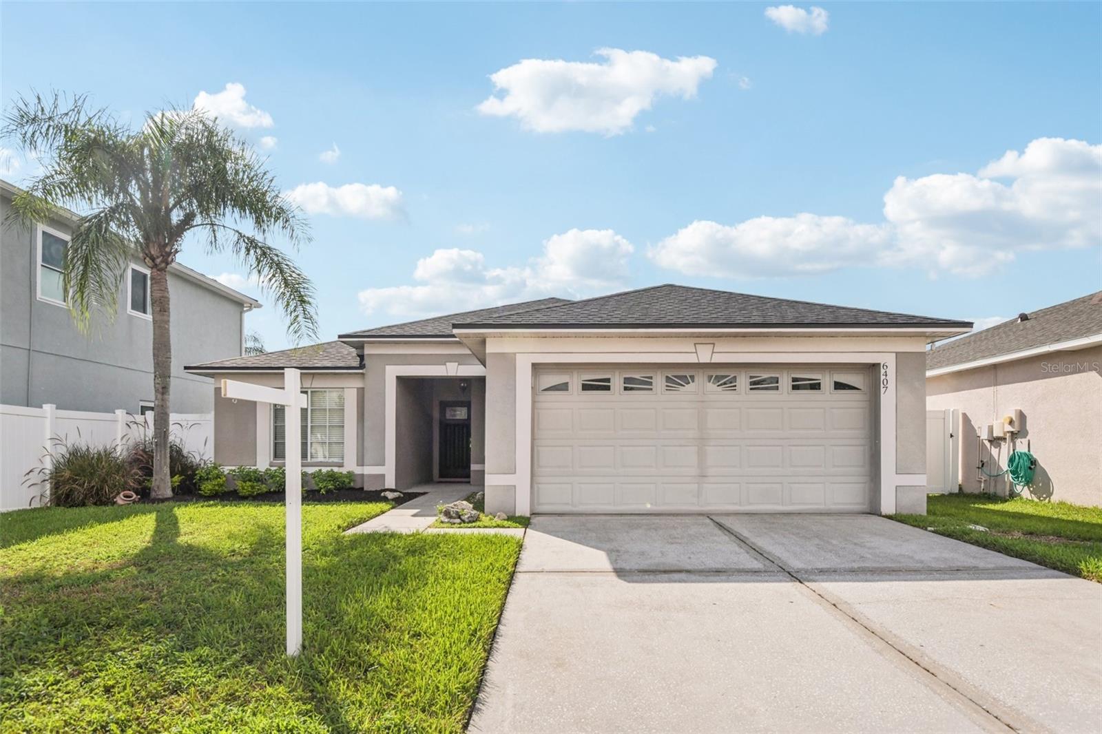 One or more photo(s) has been virtually staged. Welcome to the heart of Wesley Chapel living! This inviting 4-bedroom, 2-bath home offers a spacious open floor plan designed for comfort and functionality. Wood flooring flows throughout the main living areas, while the kitchen impresses with stainless steel appliances, granite countertops, and stylish updated lighting.
The generously sized primary suite is a peaceful retreat, featuring a luxurious bathroom complete with a garden tub, seamless glass shower, and dual sinks. Three additional bedrooms provide ample space for guests, hobbies, or a home office setup.
Enjoy peace of mind with a new roof installed in November 2024, and recent mechanical updates including a water heater and HVAC replaced in 2019. Exterior painting is also scheduled, giving the home a fresh look.
Step outside to a fully fenced backyard with an oversized paved patio and grassy area—ideal for entertaining or relaxing in privacy.
Located just minutes from top-rated schools, Wesley Chapel District Park, and the Shops at Wiregrass, plus convenient access to Tampa Premium Outlets, Epperson Lagoon, and Krate at the Grove.
With a LOW HOA and NO CDD, this home combines comfort, style, and convenience in one beautifully maintained package. Don’t miss this opportunity!